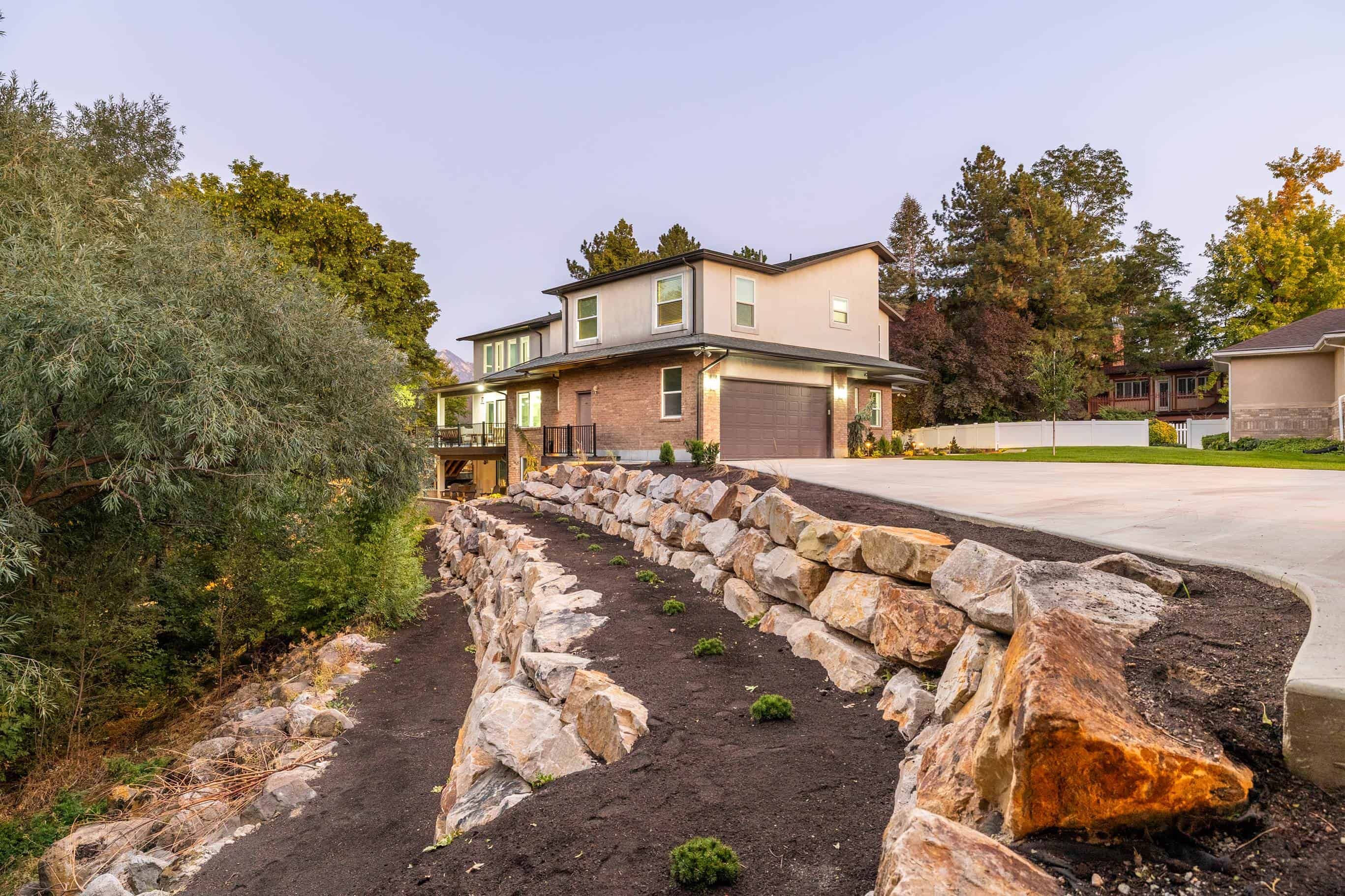 Three-level boulder retaining wall in Murray, Utah.