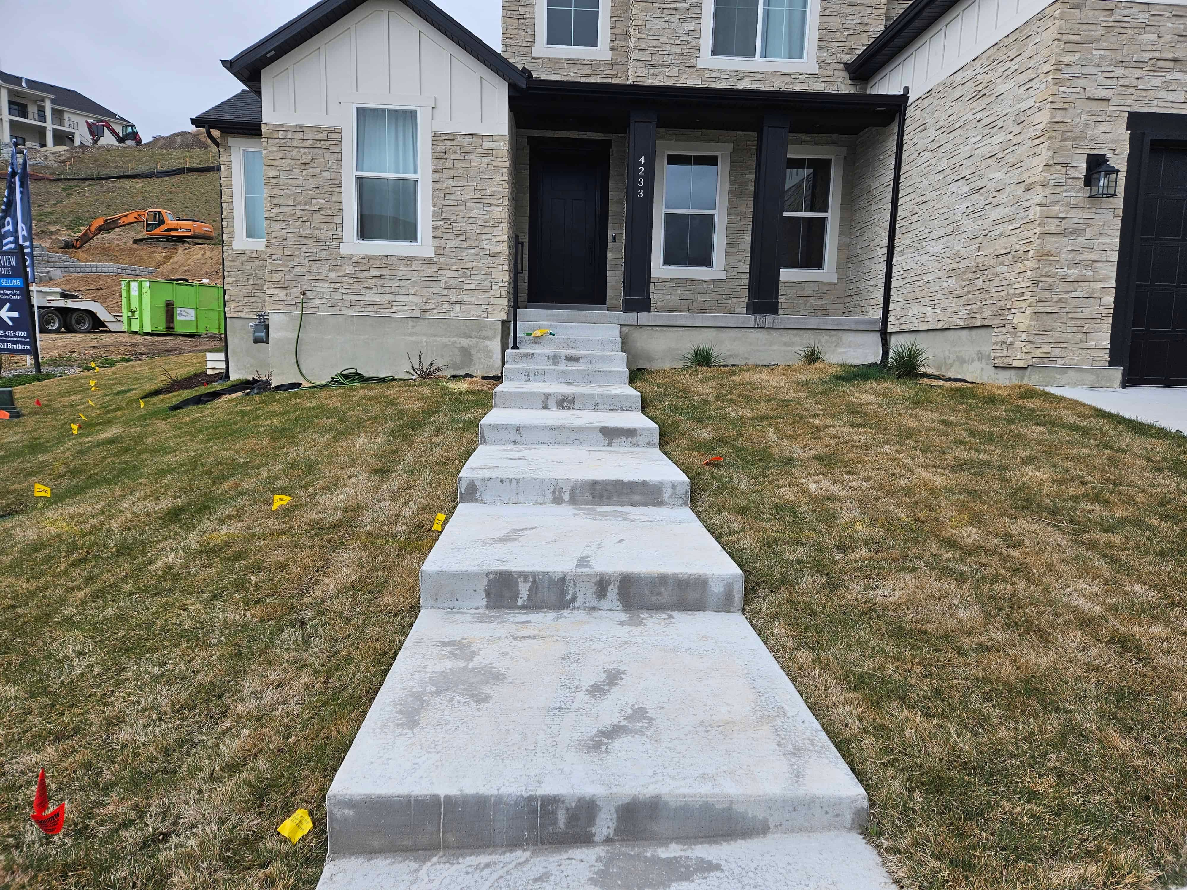 Before photo of front yard walkway in Lehi, Utah prior to landscape renovation.