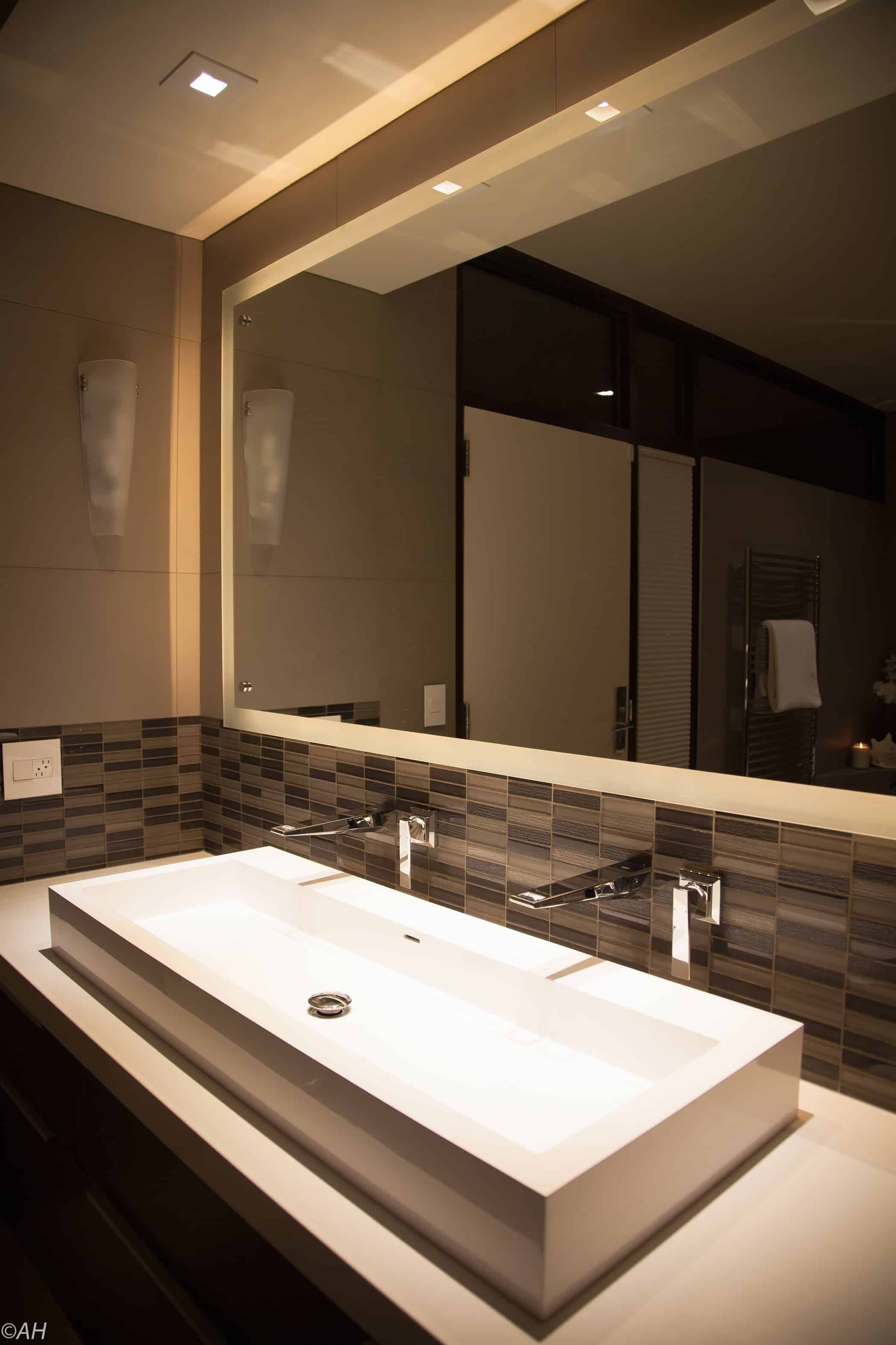 Vanity with granite, custom carpentry, and custom lighting in Sandy Utah bathroom remodel.