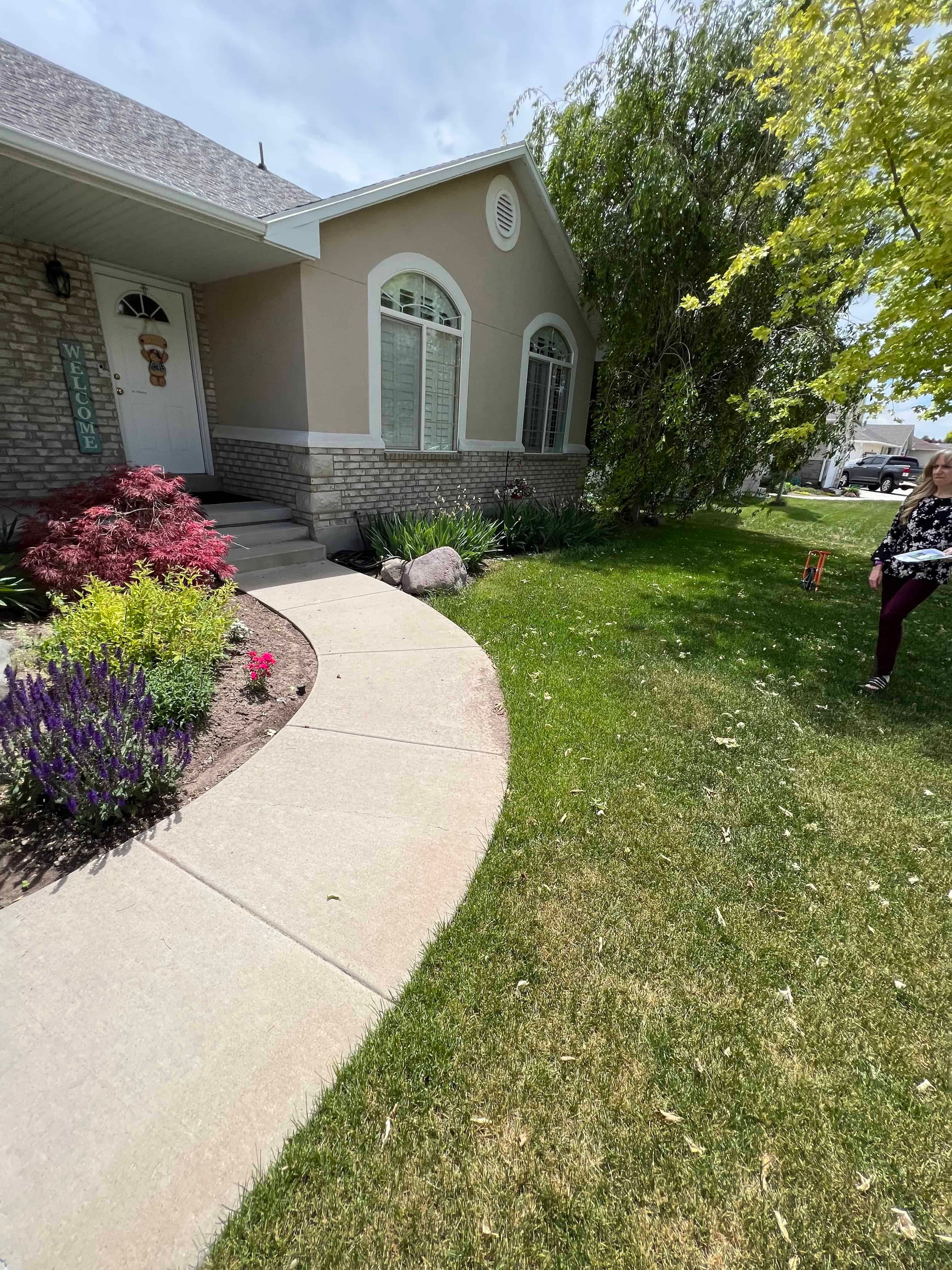 Before photo of front walkway in West Jordan, Utah prior to landscape renovation.