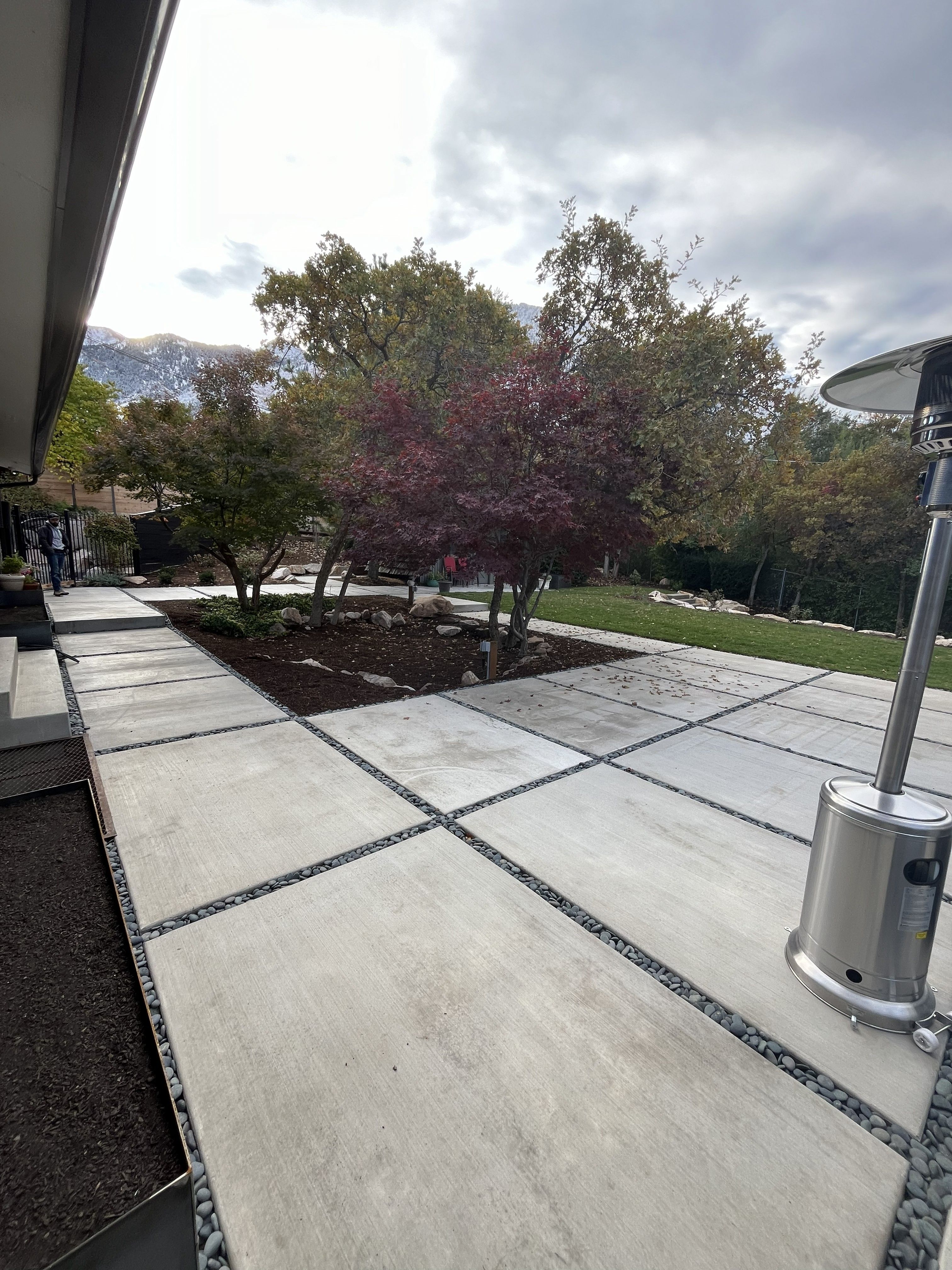 Large modern concrete patio with clean finish in Holladay, Utah.