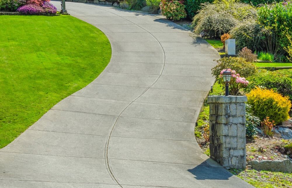 Winding concrete pathway designed and installed by top concrete contractors in Riverton, Utah.