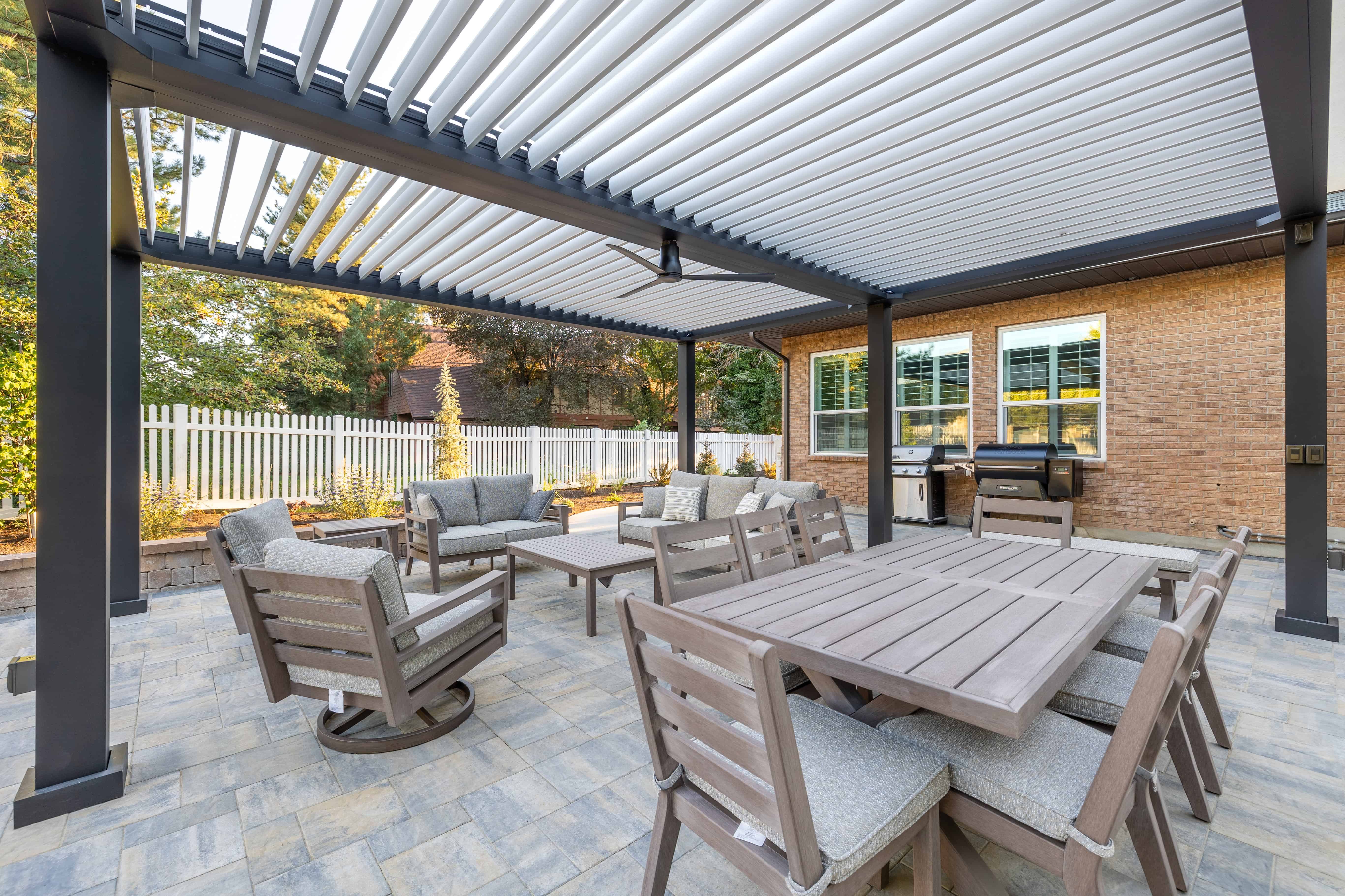 Outdoor seating area with shade covering on a pavers patio in Murray, Utah