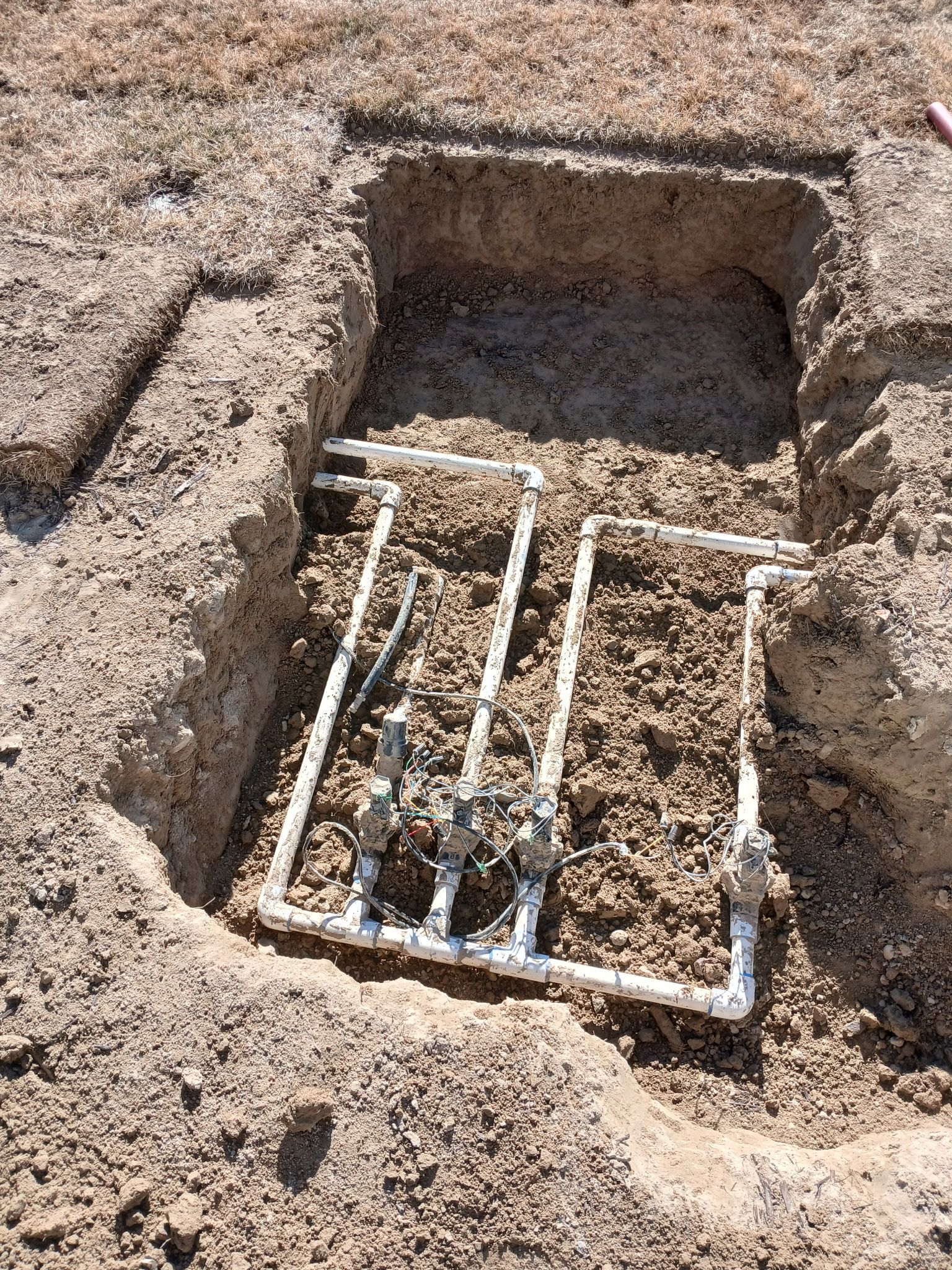 Sprinkler valve box in front yard that needs to be moved