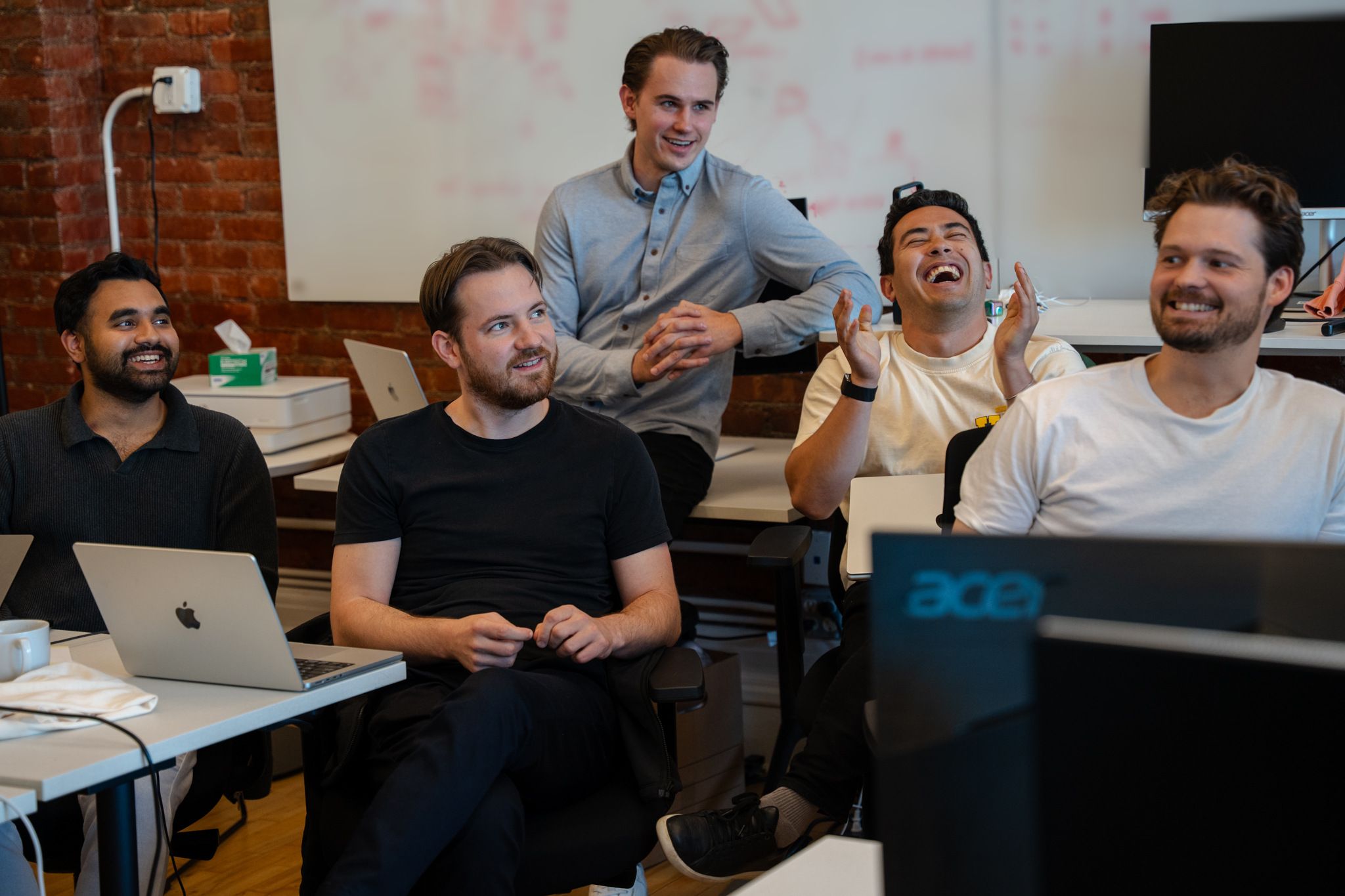Avallon team laughing together in the SoHo office