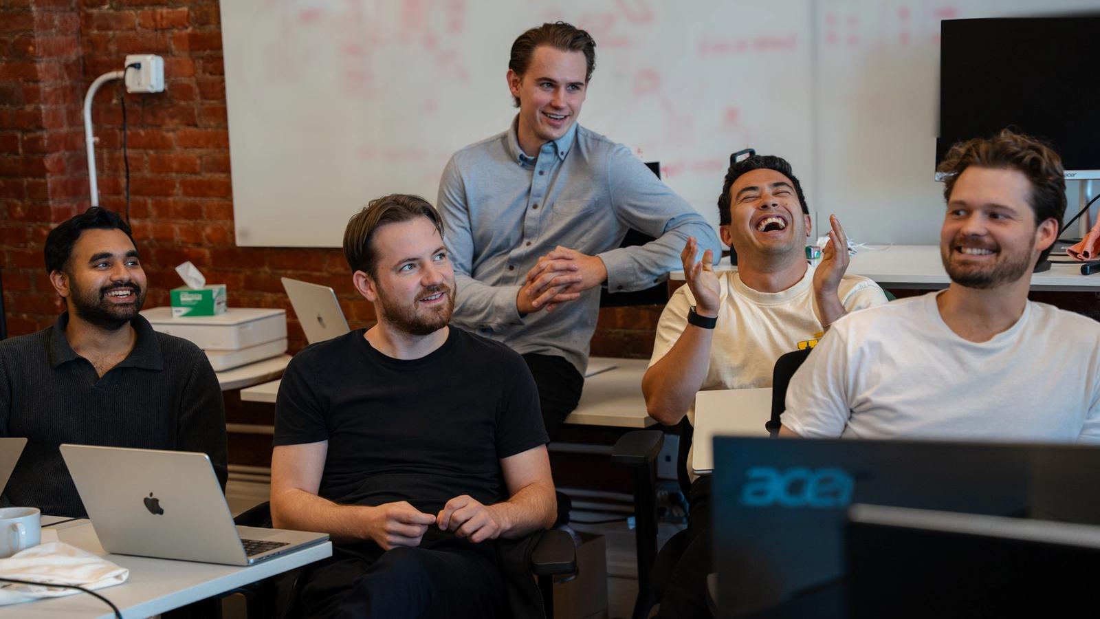 Avallon team laughing together in the SoHo office