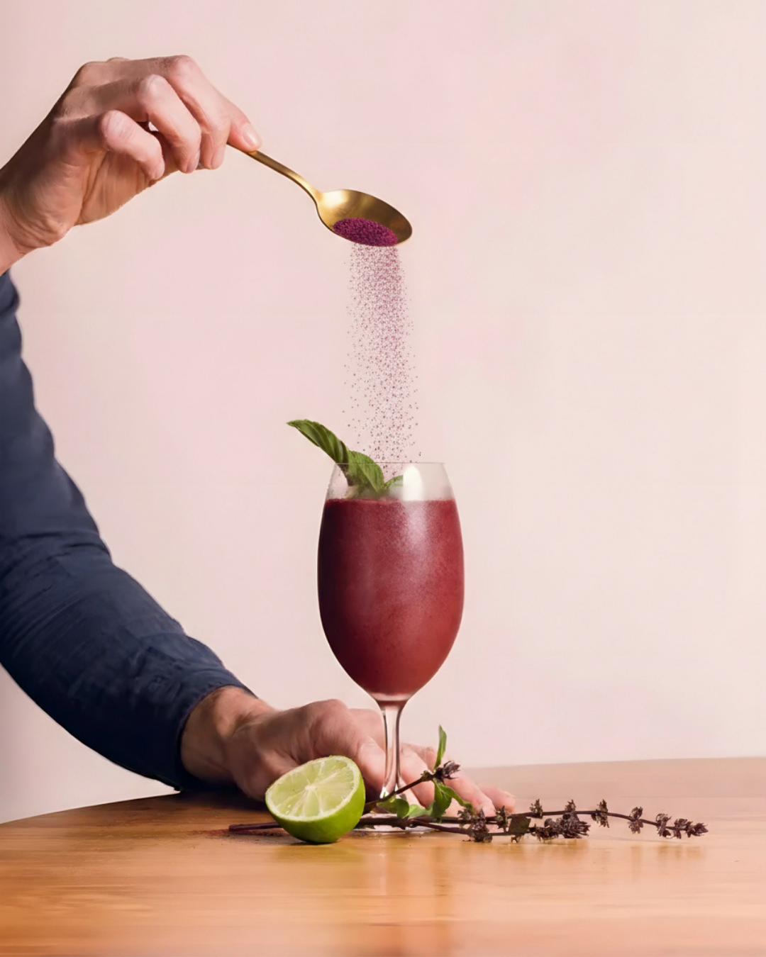 Queen Garnet Nectar of gods slushie with Queen Garnet powder being poured in from above