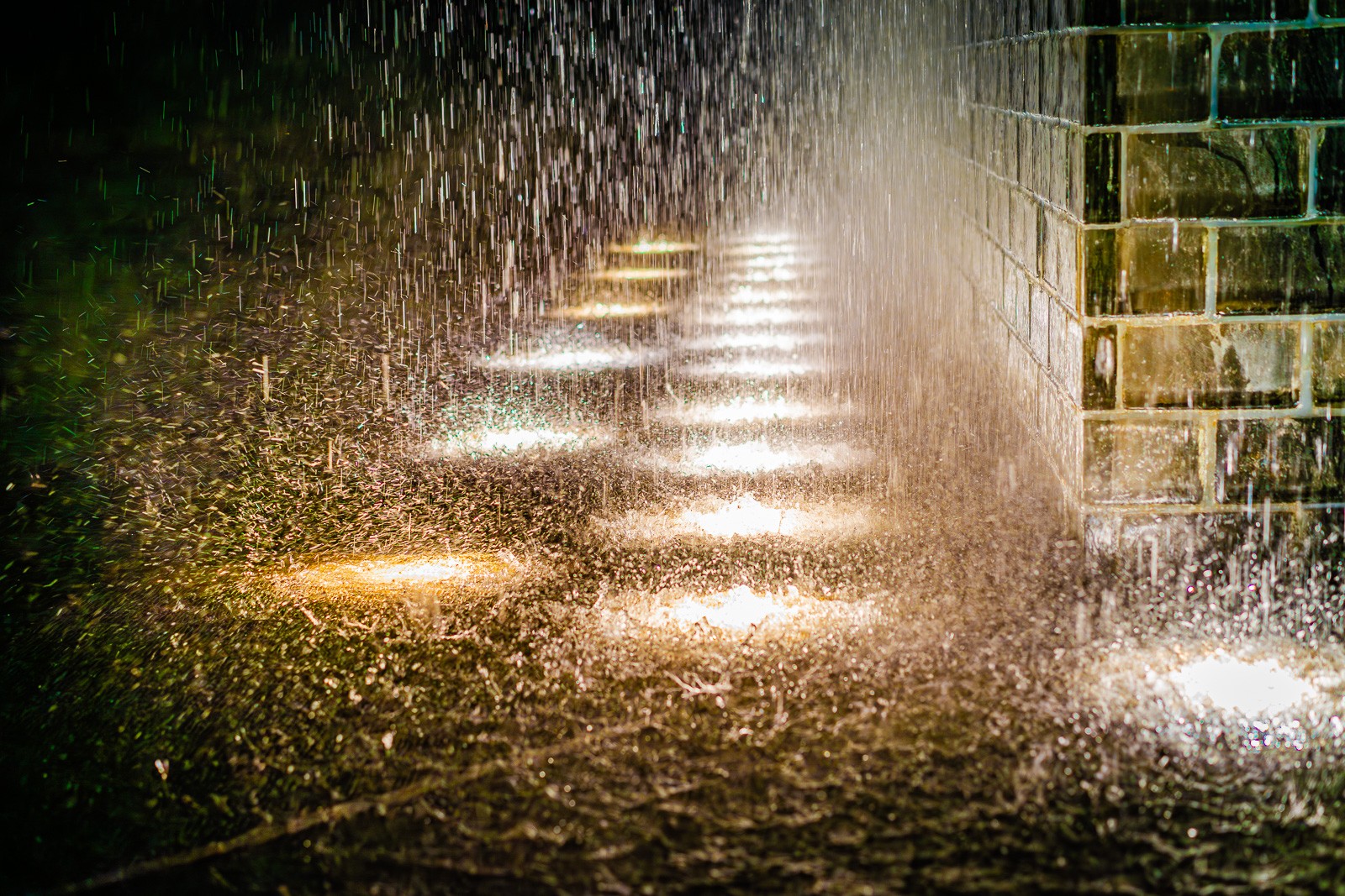 A water sculpture in Chicago, light from below and water from above. Never-ending raindrops.