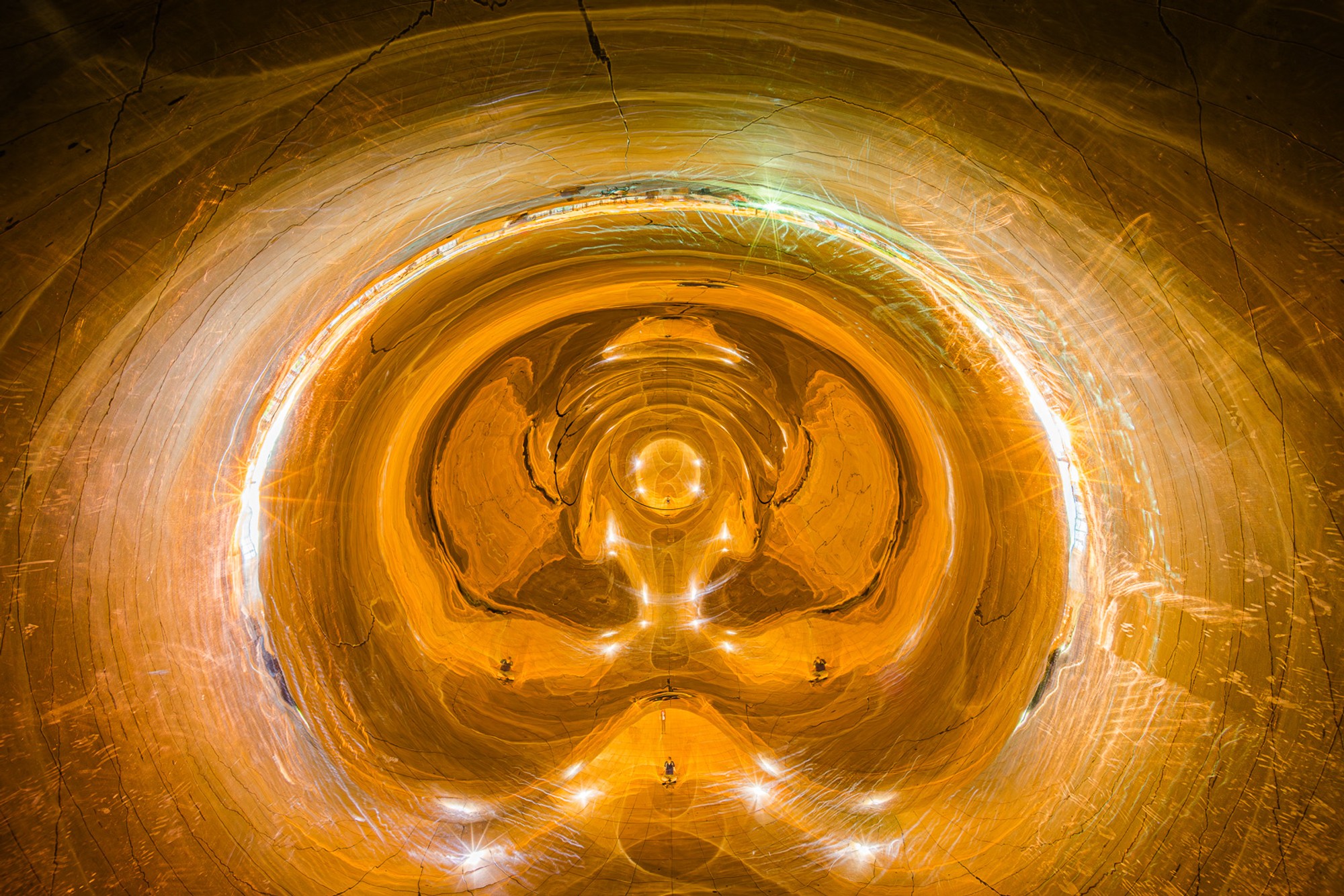 The underside of Cloud Gate in Chicago photographed from directly below, the polished steel reflecting a fisheye distortion of Millennium Park and the skyline. The sculpture shows the city everything except the city itself.