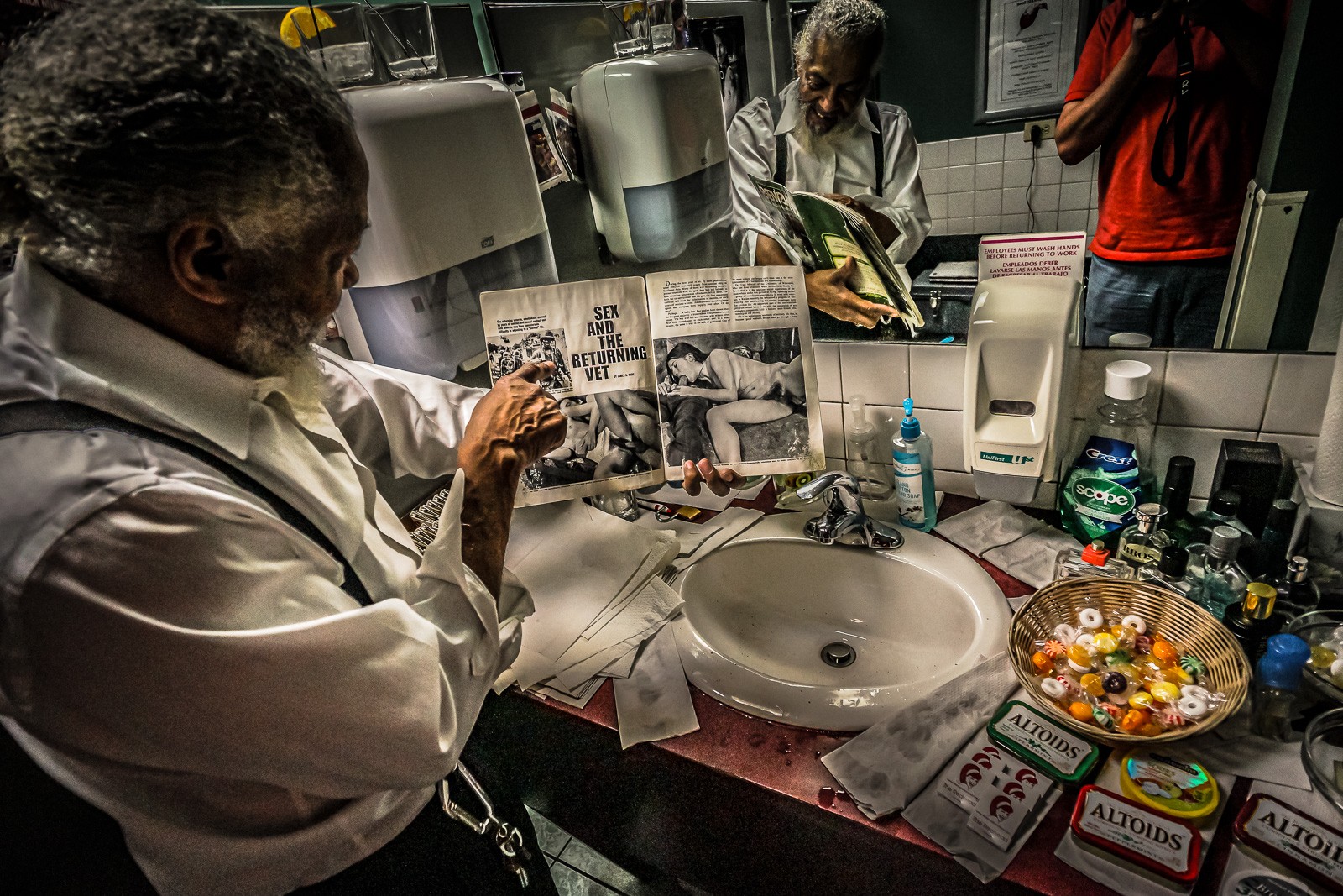 The men's restroom of a Chicago jazz club - a man at the sink surrounded by the paraphernalia of the evening. An image taken in a room that politely asks to be forgotten.