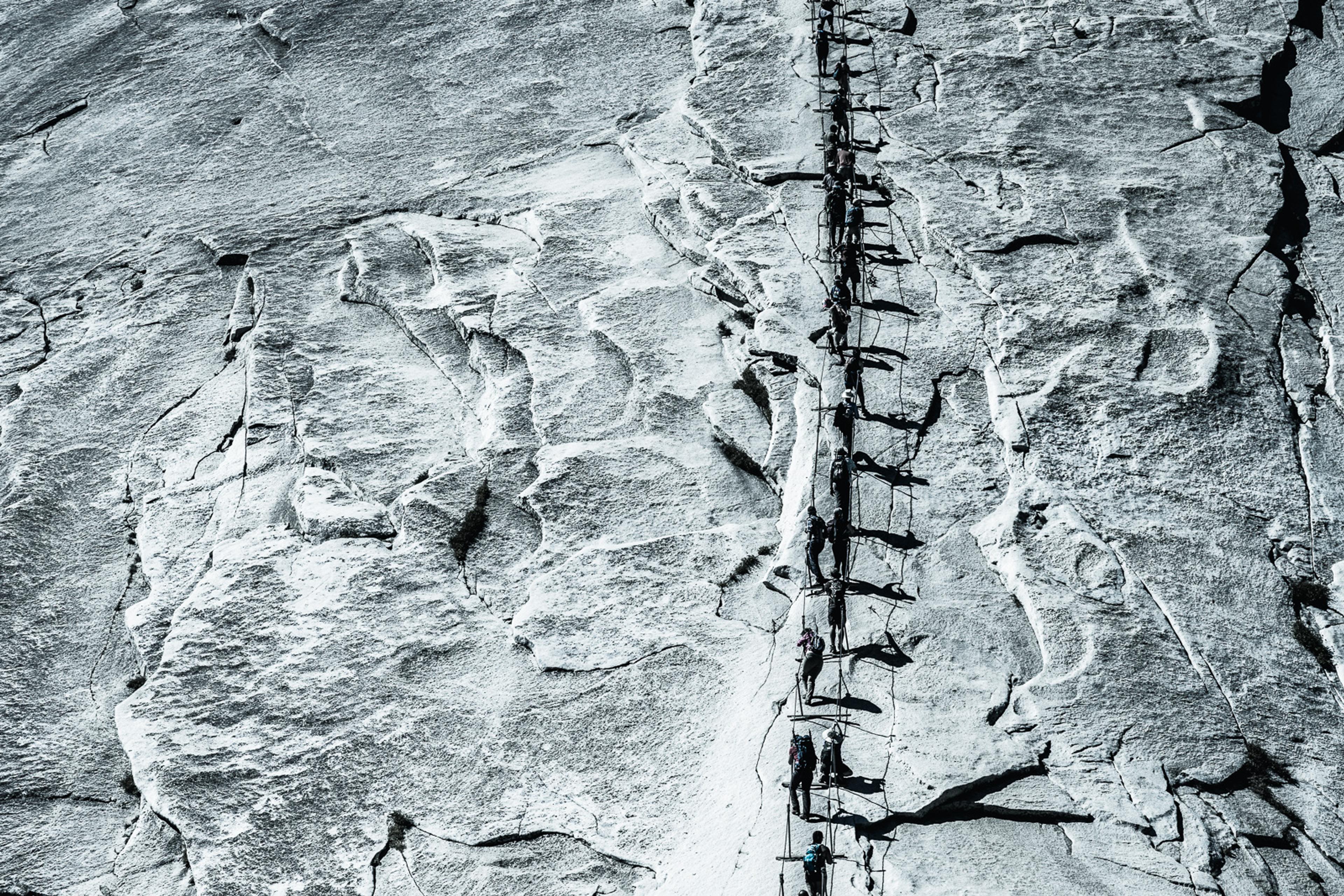 Half Dome cables, the granite dome quiet against a deep sky above the shadowed valley.