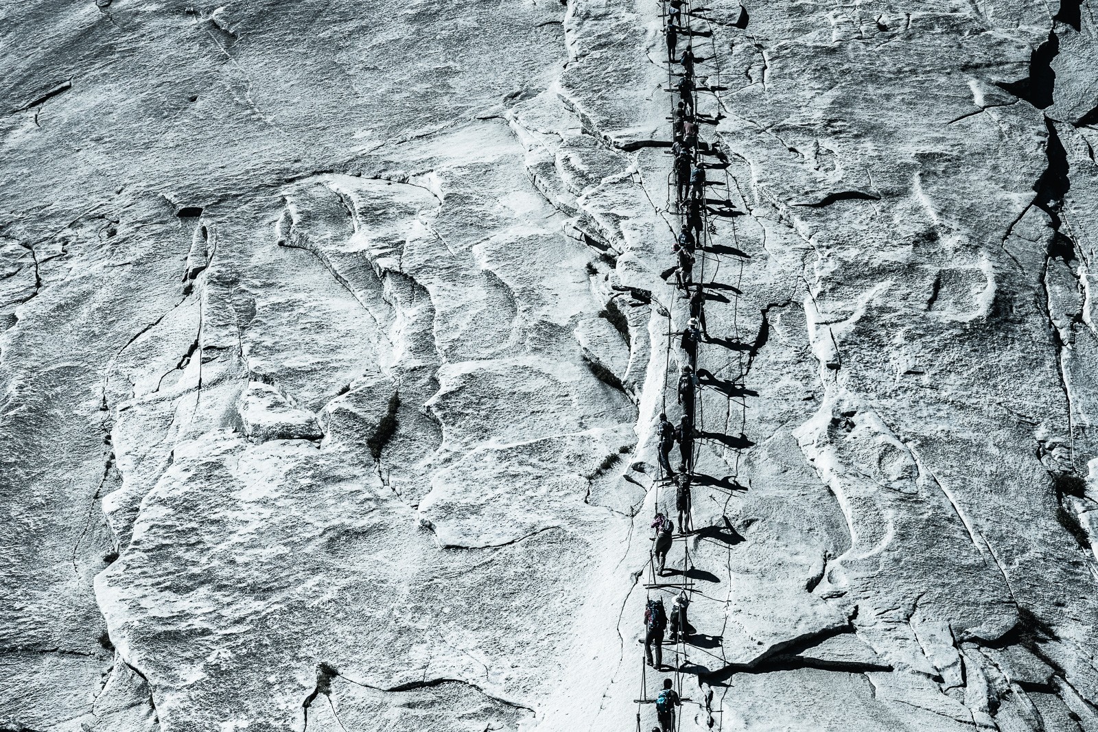 Half Dome cables, the granite dome quiet against a deep sky above the shadowed valley.