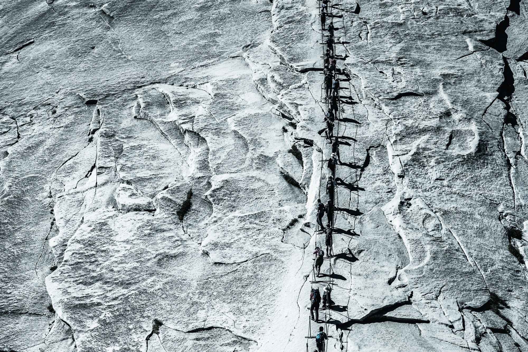 Half Dome cables, the granite dome quiet against a deep sky above the shadowed valley.
