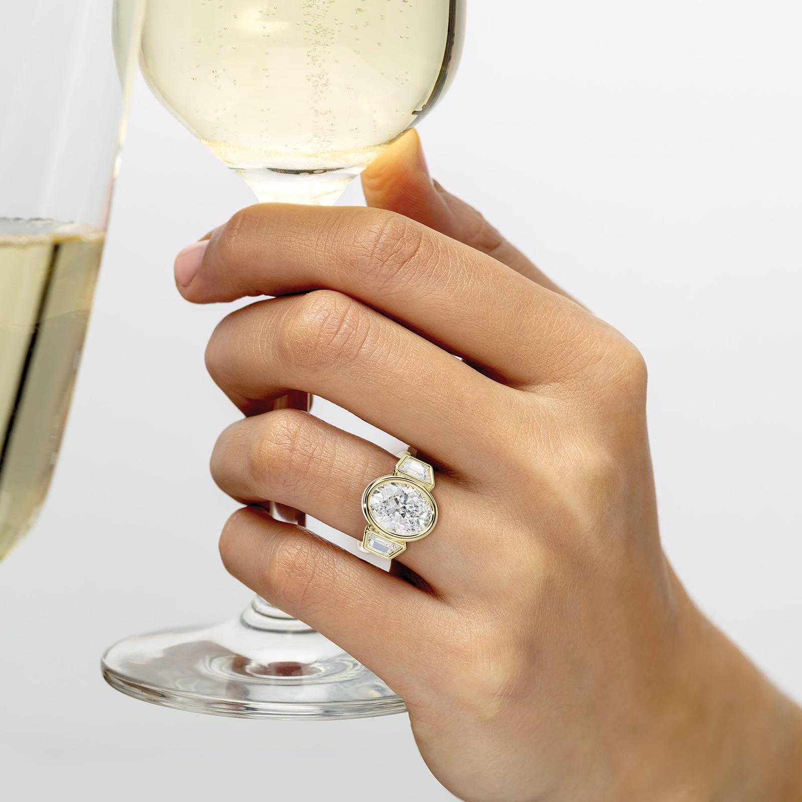 Cleo Oval Center With Trapezoid Side Diamond Engagement Ring