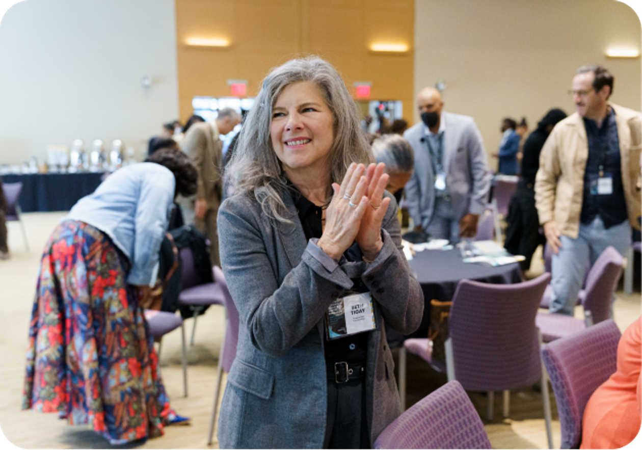 Attendee applauding at a Black Equity Collective convening