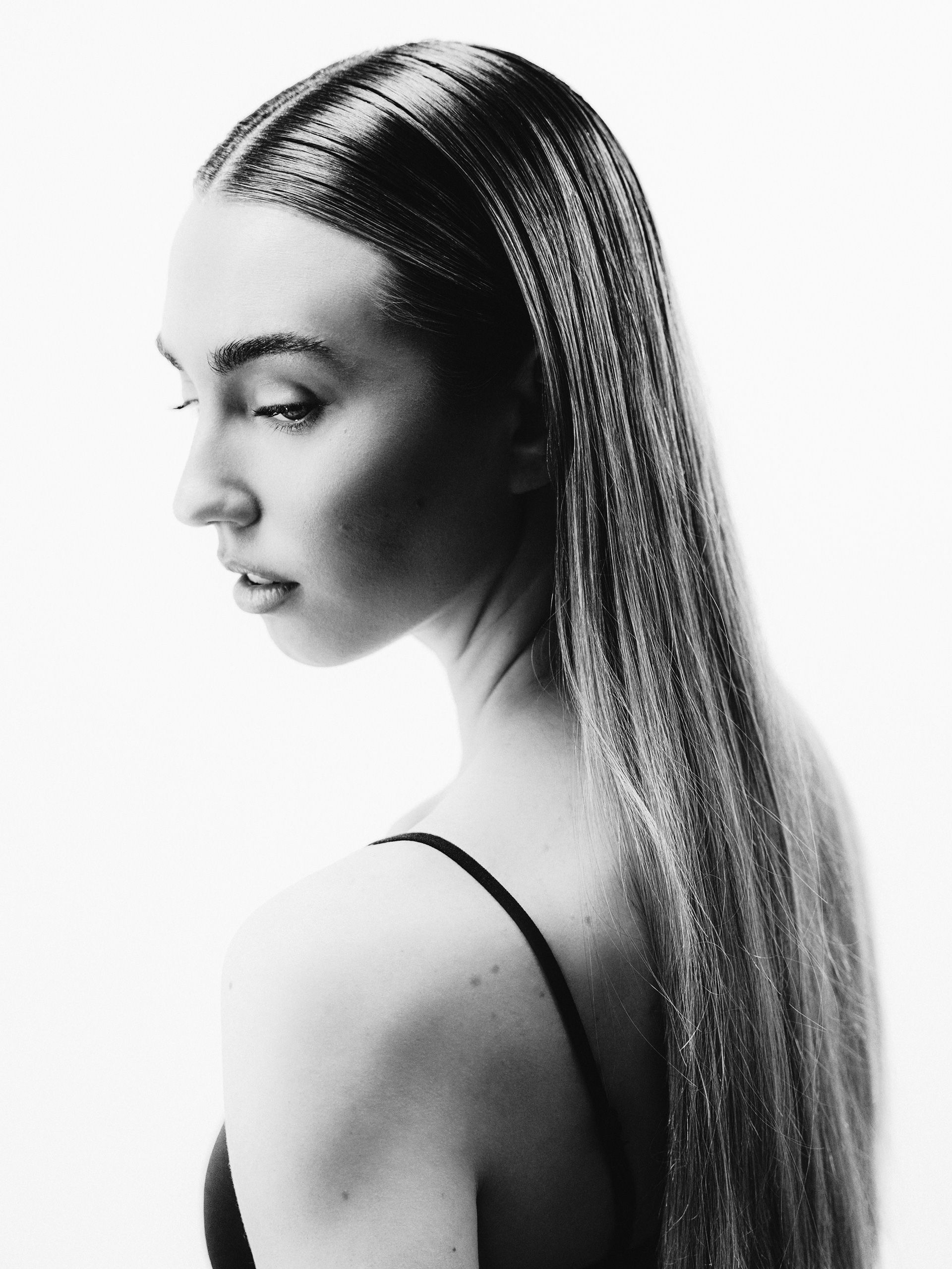 Black-and-white portrait in profile against a light background.