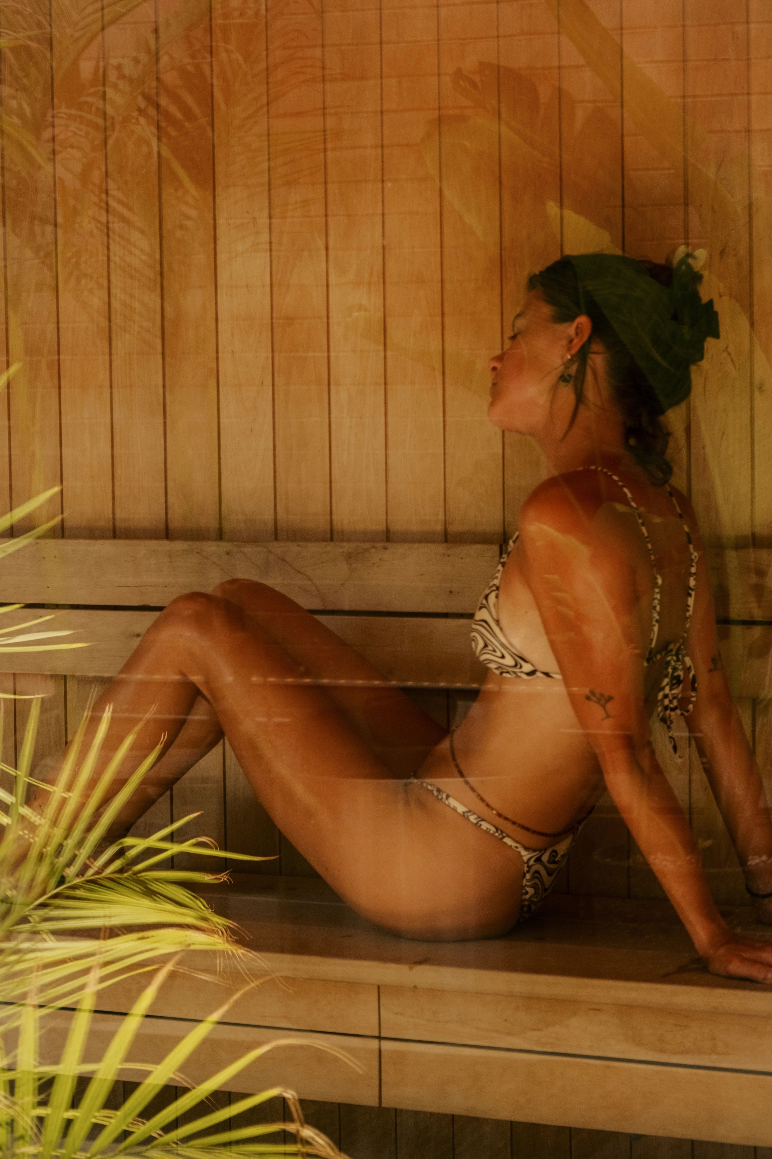 Guest seated quietly in the Likeminded sauna.