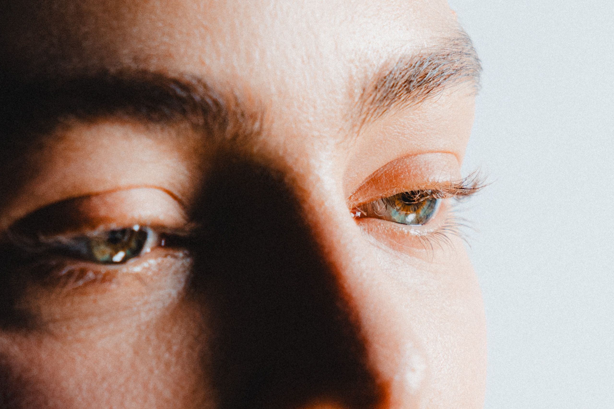 Detailed close-up of eyes and natural skin texture.
