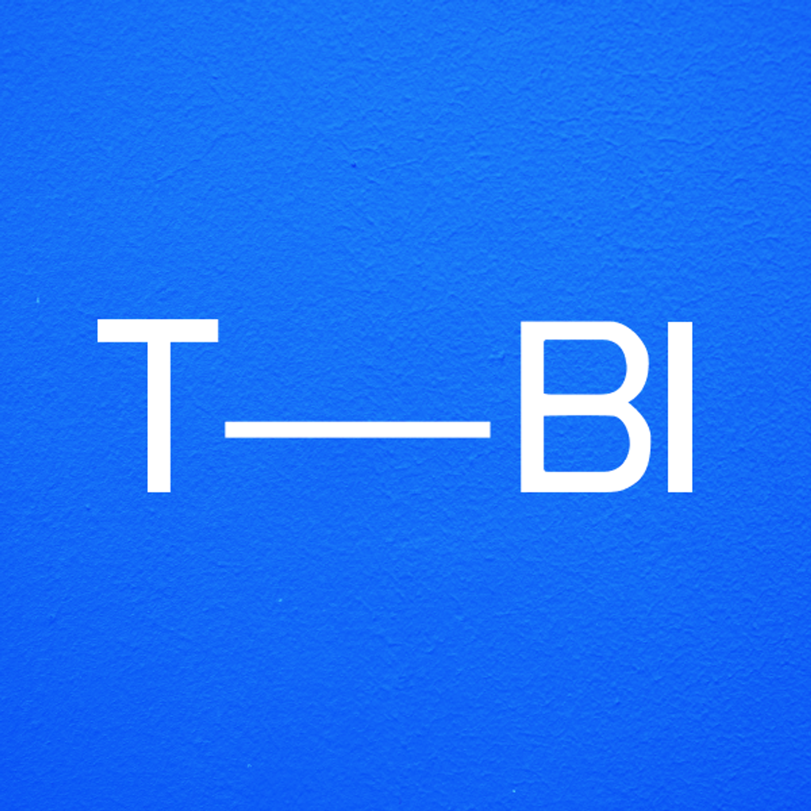 The Brand Identity logo against a blue wall.