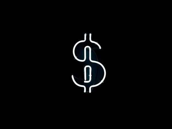 Devenir riche : un signe dollar lumineux