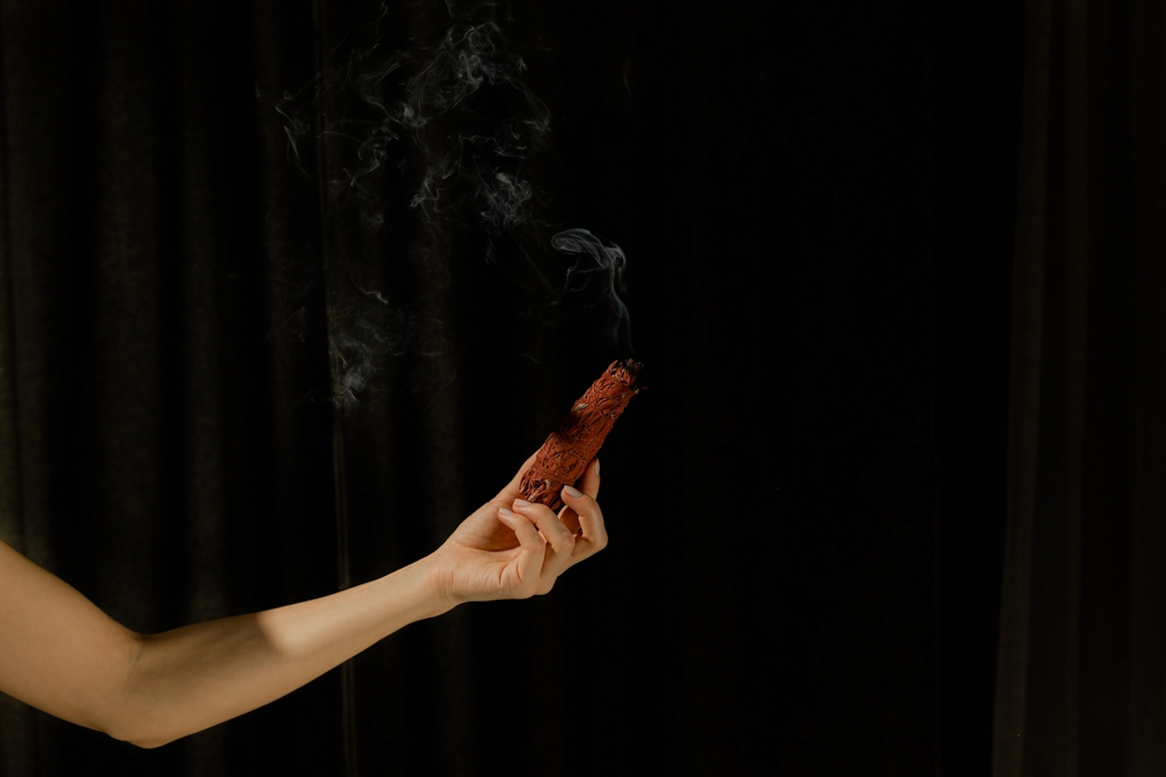 Person holding palo santo