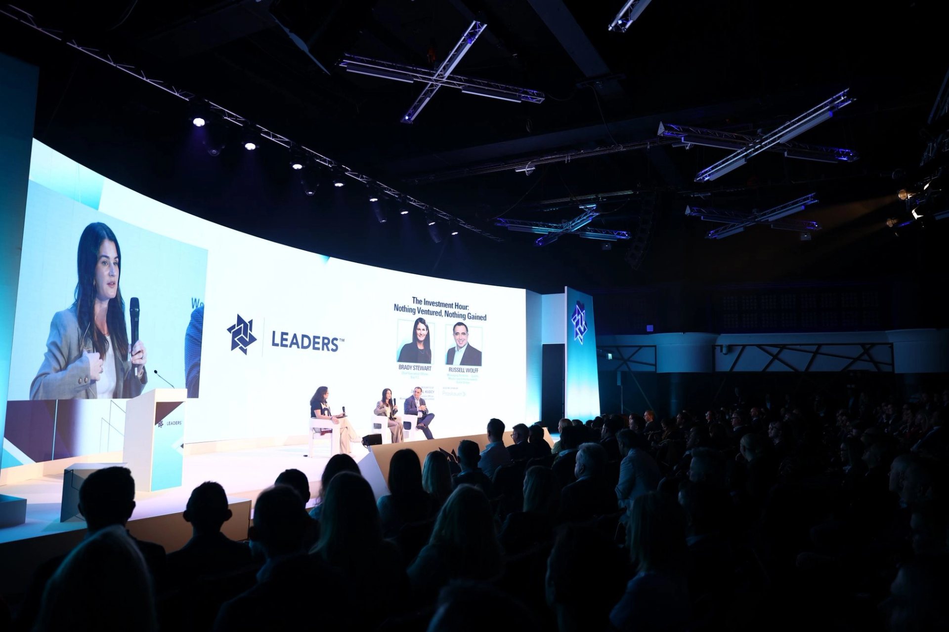 A speaker addressing a live conference audience at a Novum Live event