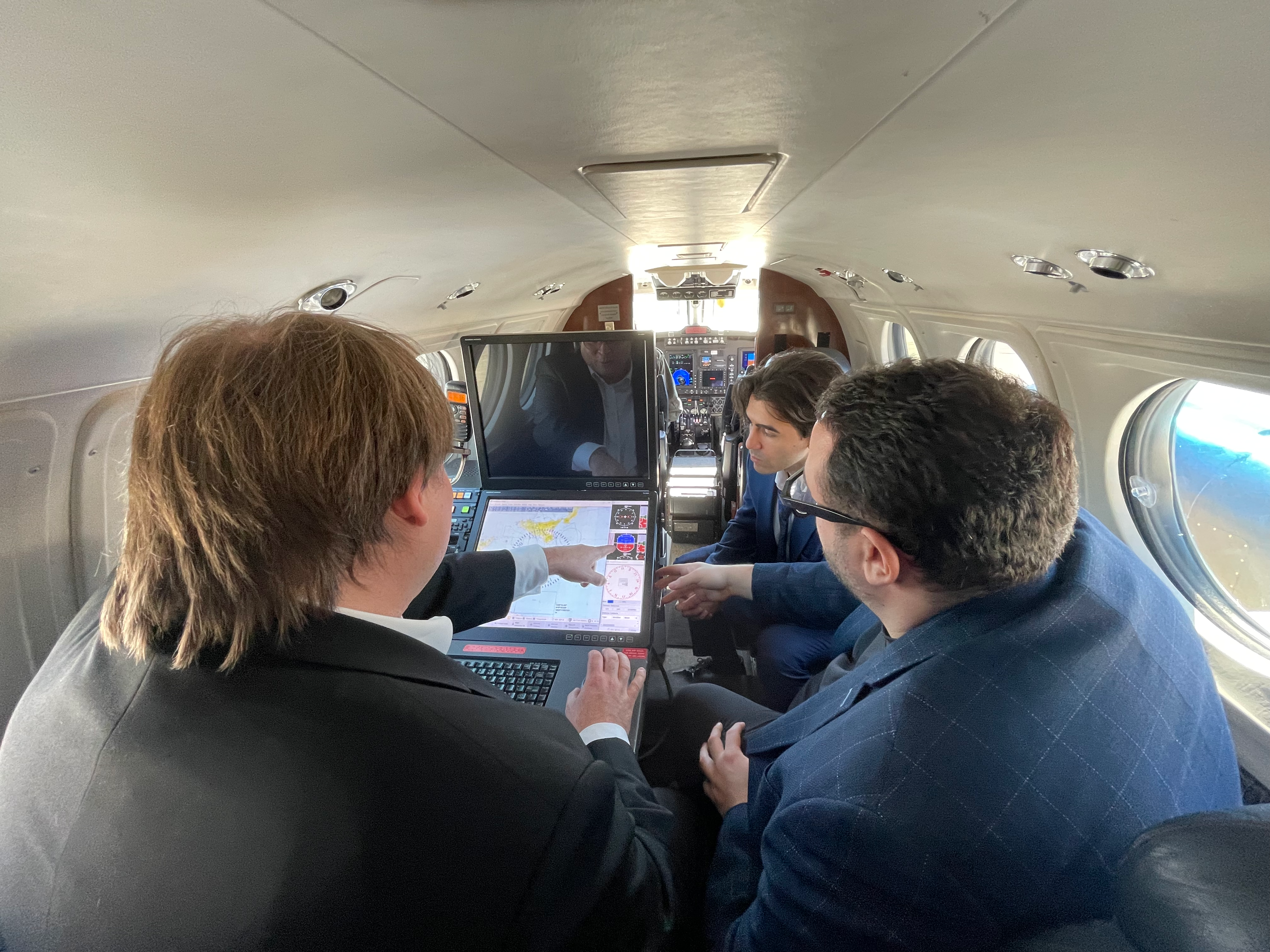 Aerodata and DMI engineers working at the on-board AI enabled operator station