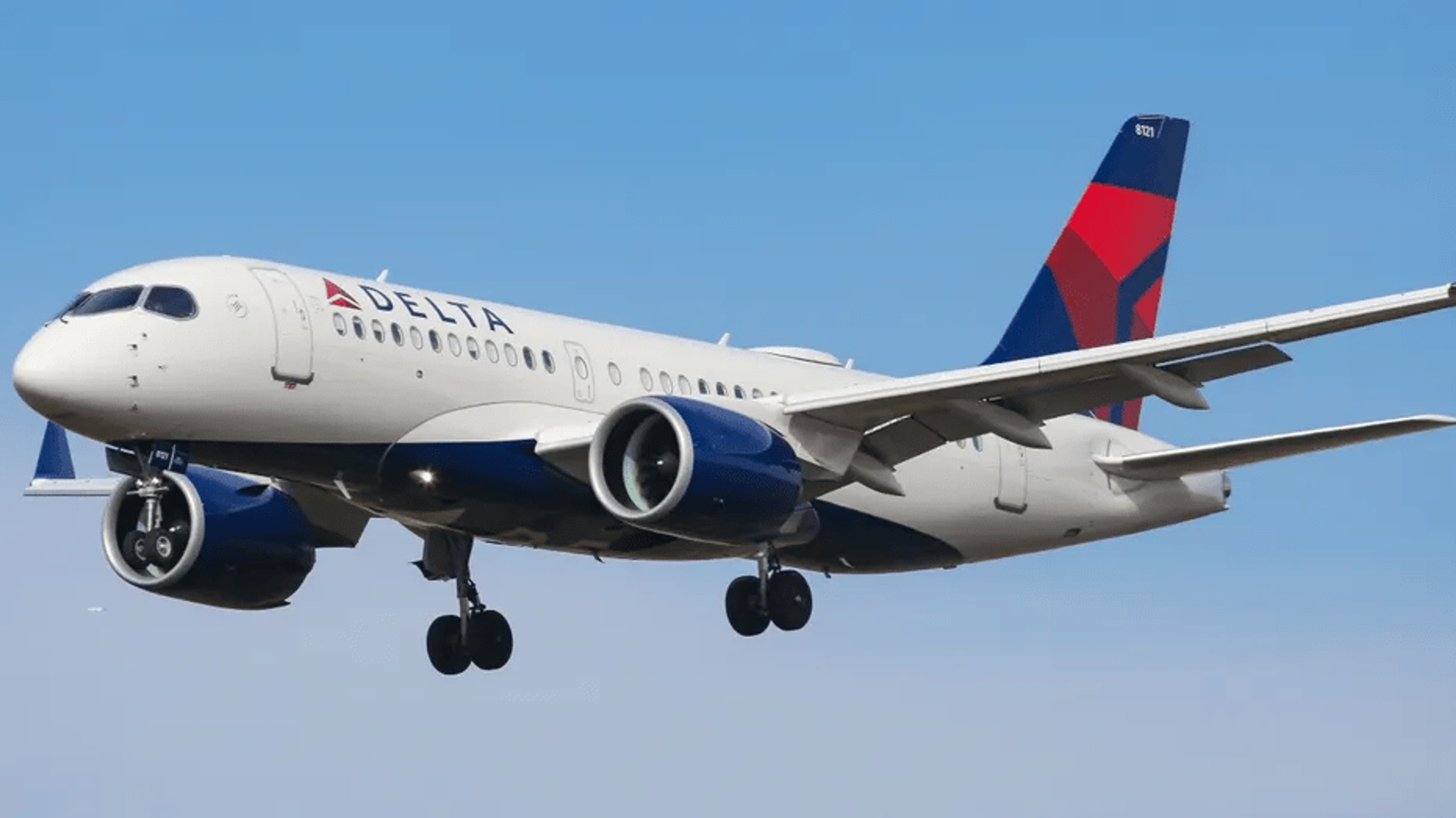 A photo of a Delta plane flying through the air