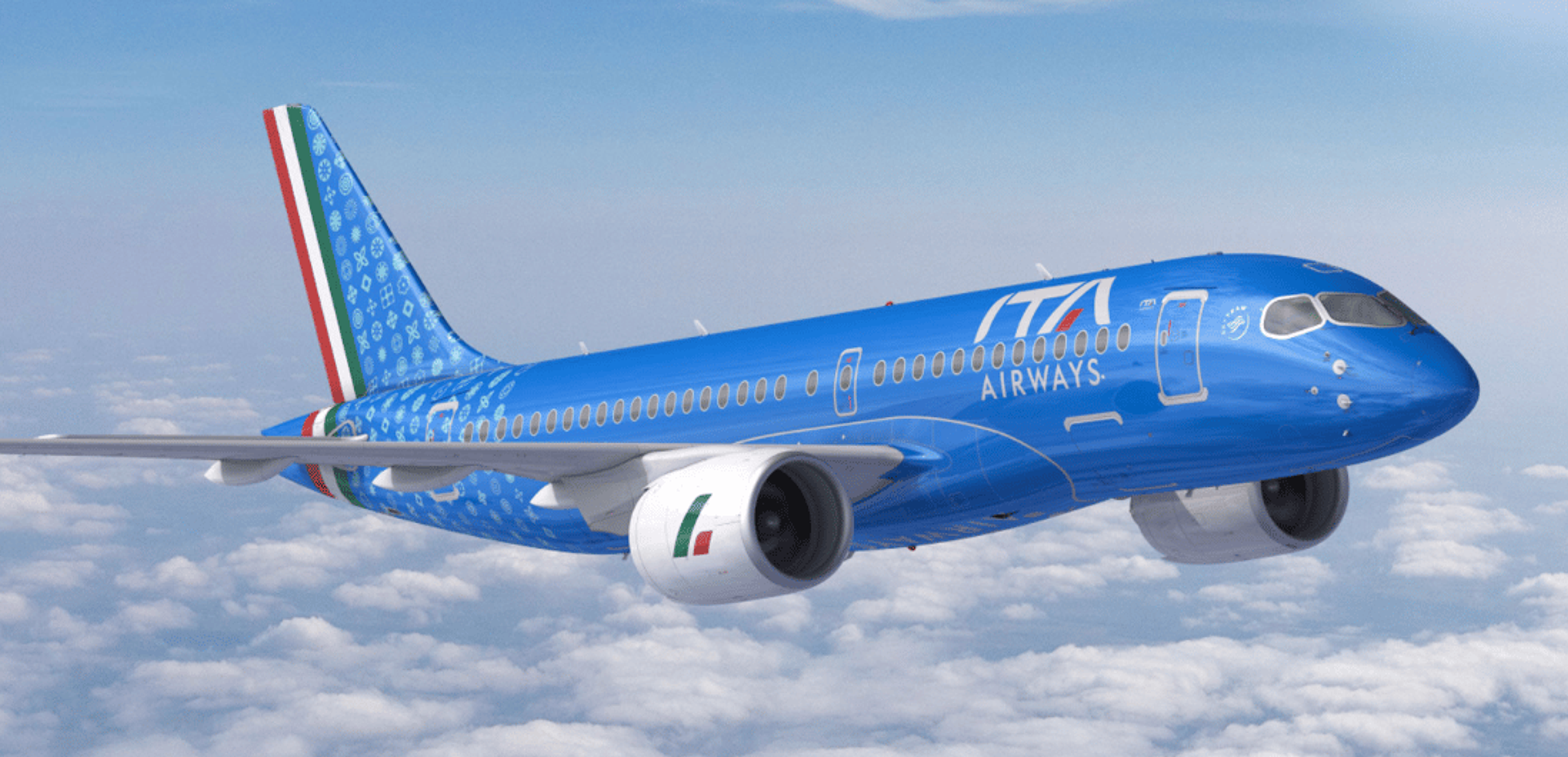 A blue plane with Italian logos flying above the clouds