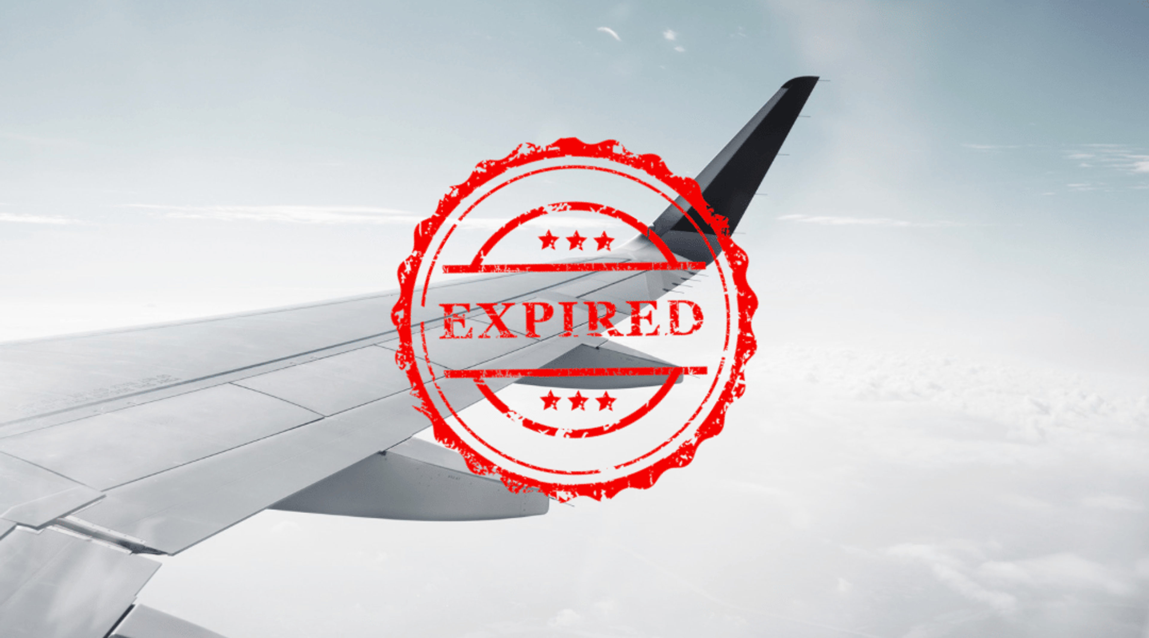 An airplane wing with a red "Expired" stamp