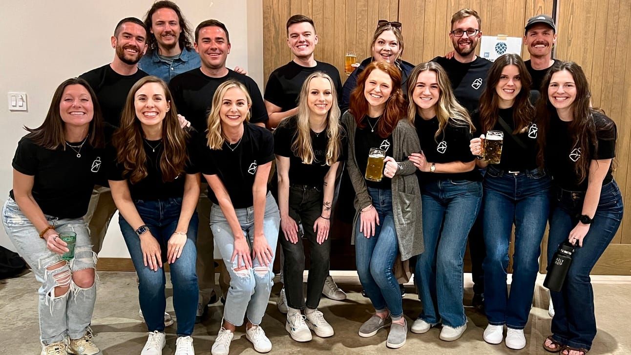 A group of the members of the Daily Drop team posing for a picture.