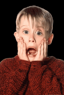 A gif of young Macaulay Culkin screaming with his hands on his face