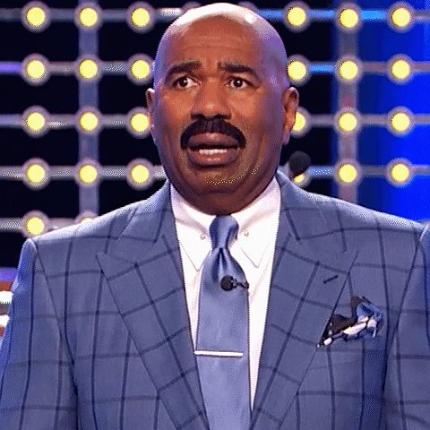 A gif of Steve Harvey having a panic attack
