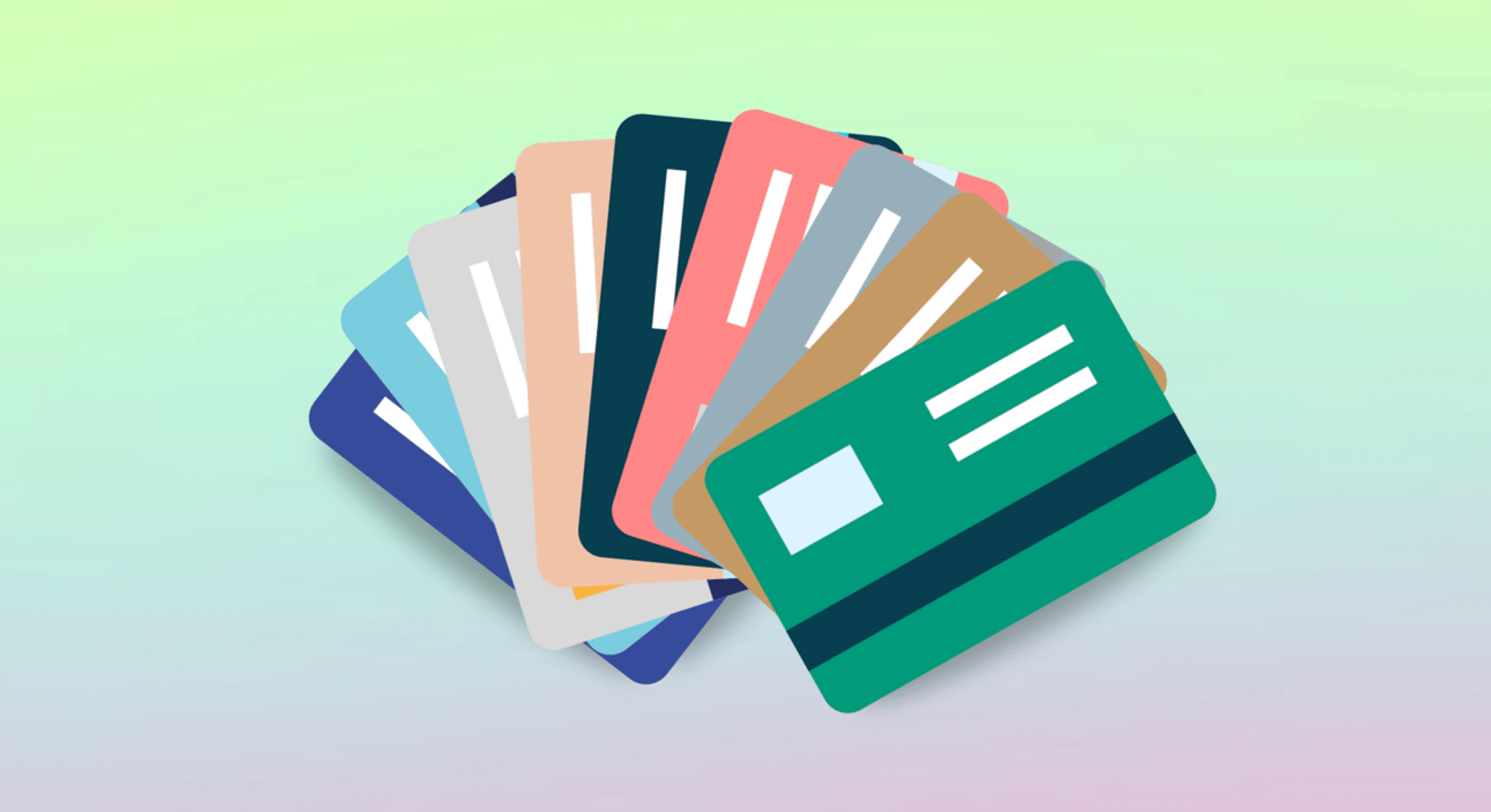 Credit cards fanned out on a pink and green ombre background