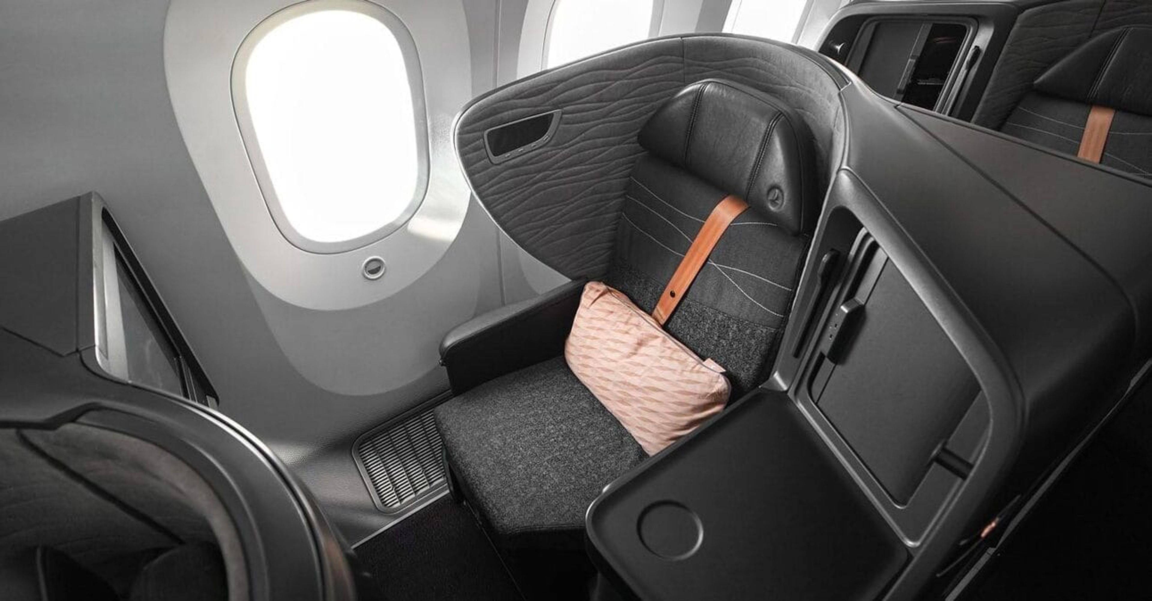 A sleek looking grey business class suite