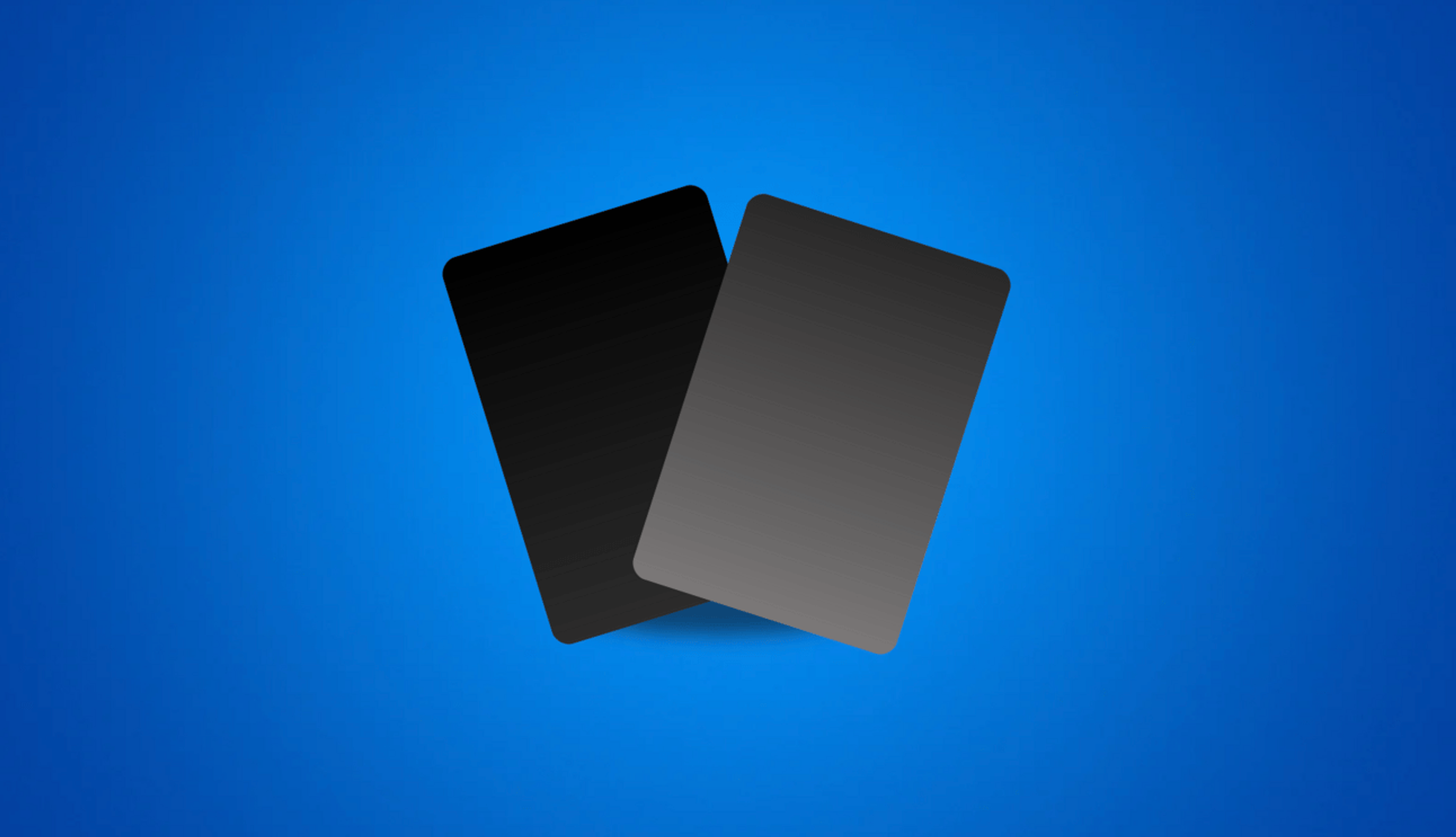 A black and grey credit card on a blue background