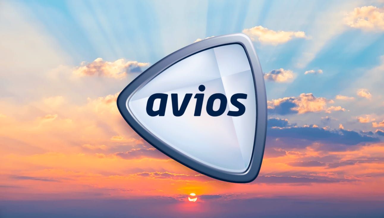 Avios logo with a sunset background