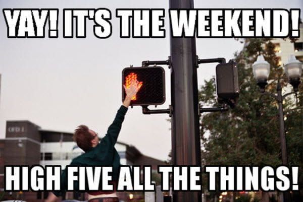 Someone jumping up and high-fiving a crosswalk sign