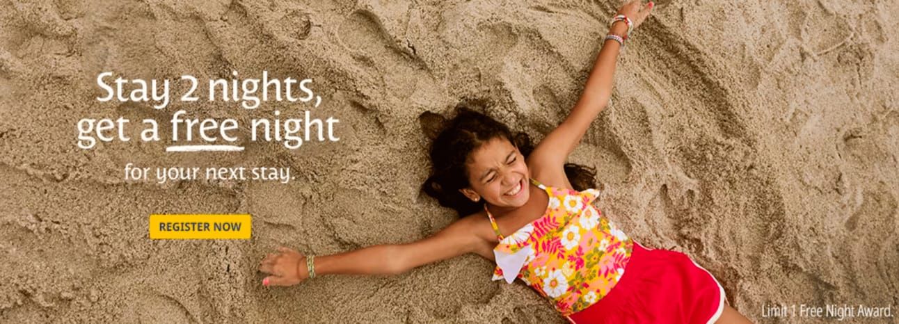 A young girl lying in the sand