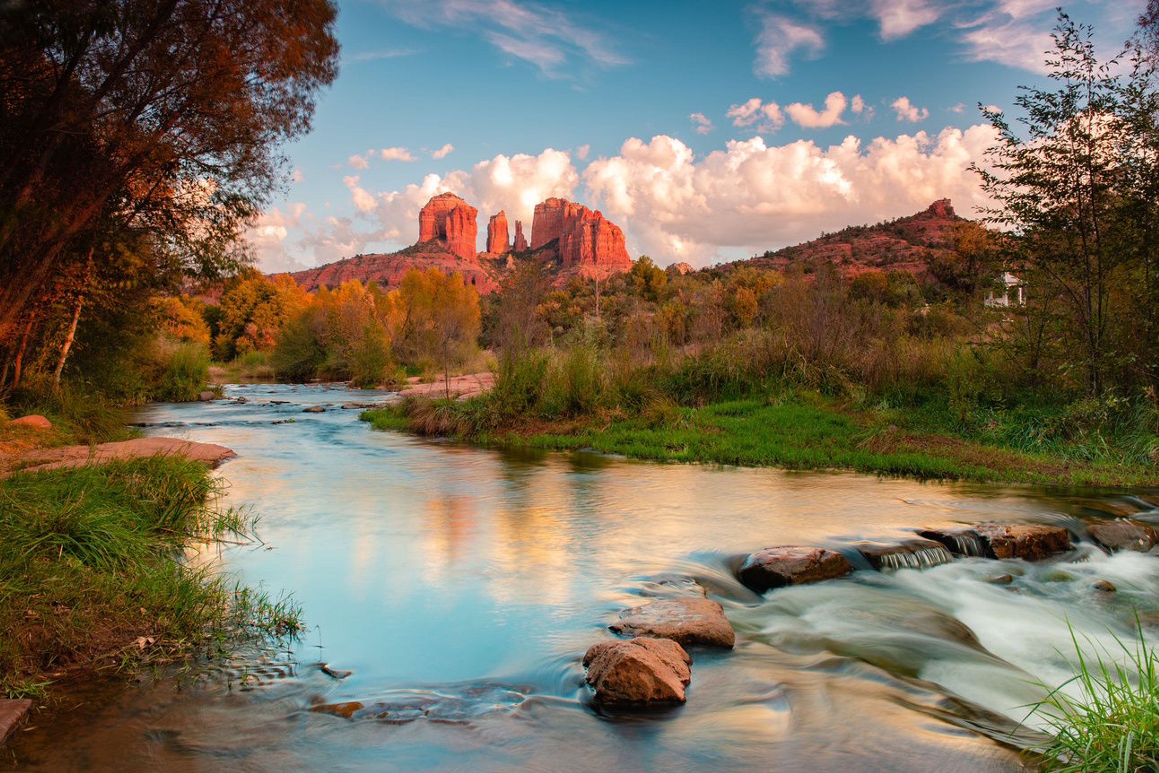 Scenic shot in Sedona of a river with red rocks in the background