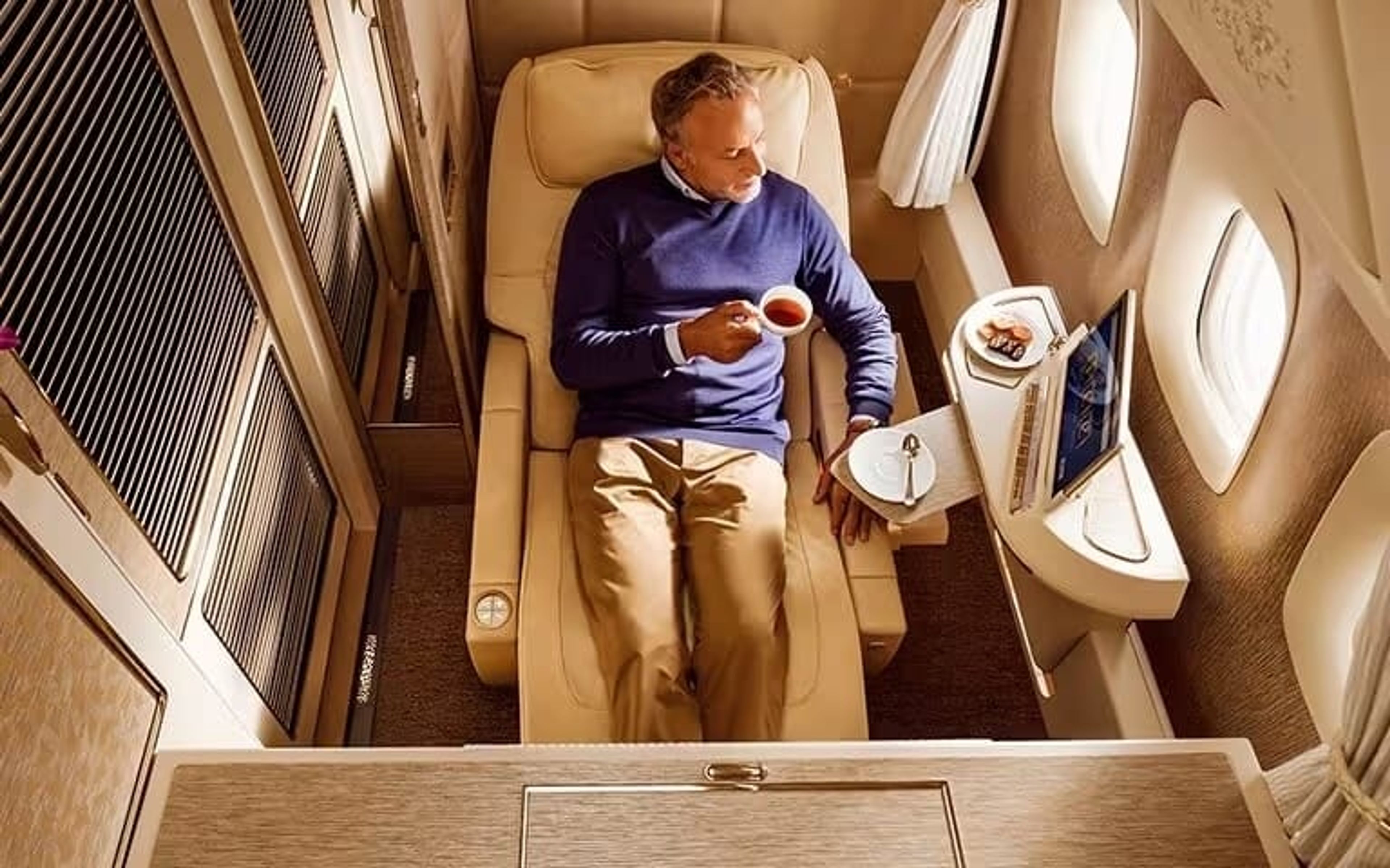 Photo of someone sitting in emirates first class