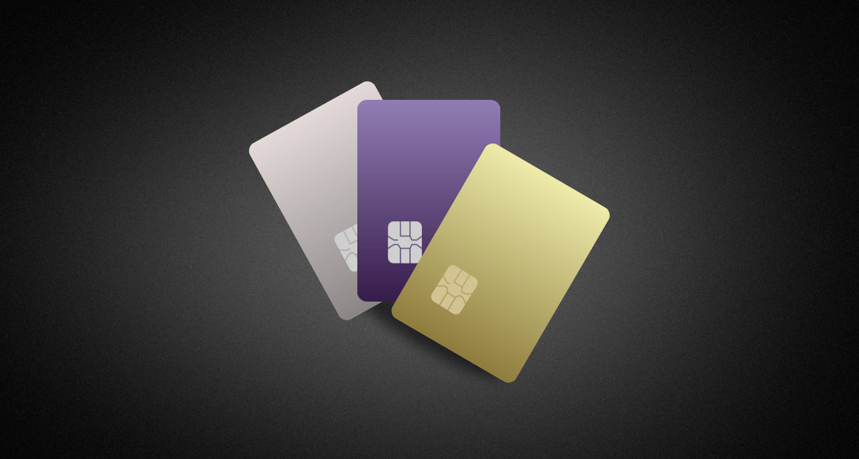 Three credit cards on a black background