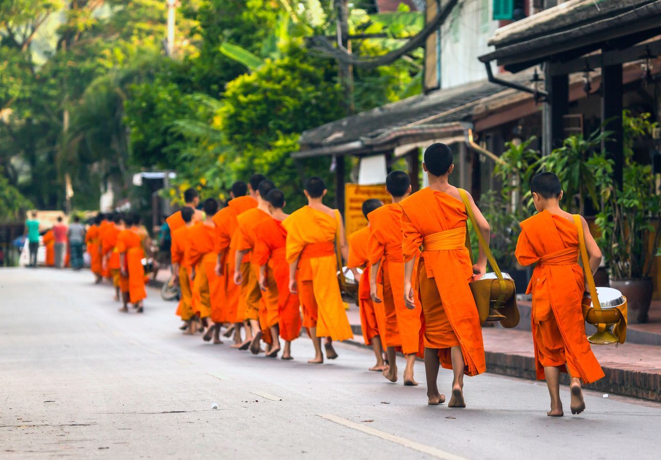 A photo of monks collecting alms in Luang Prabang