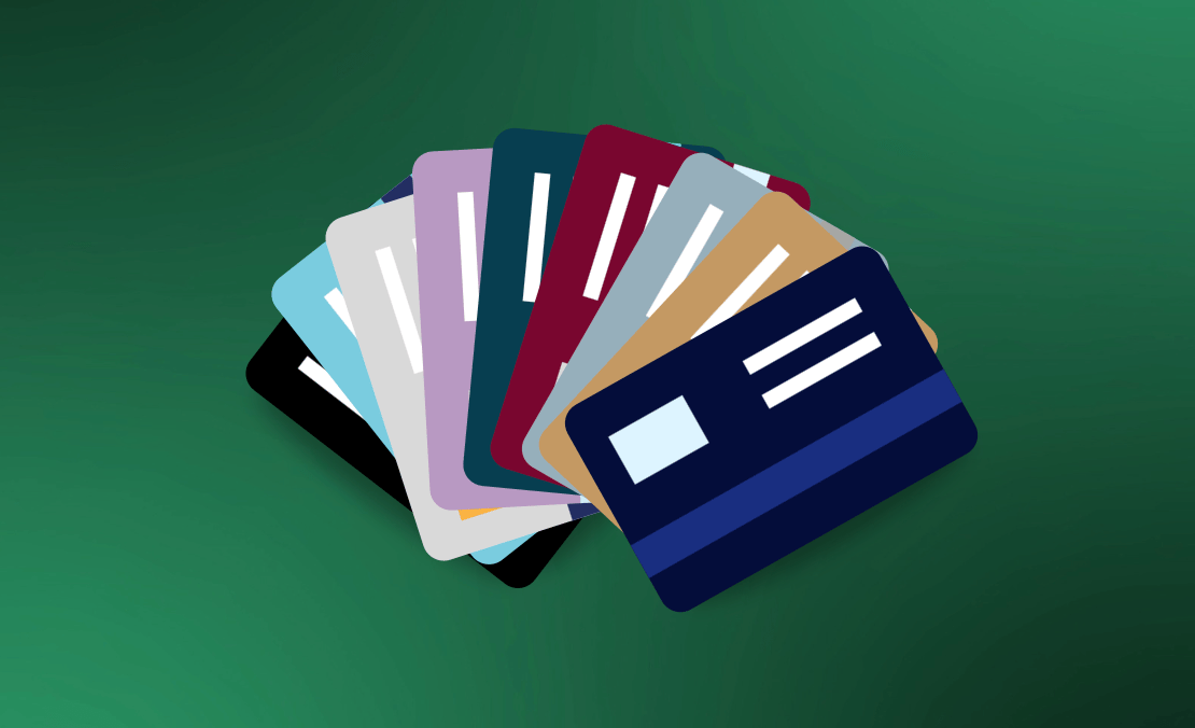 A fan of credit cards spread out on a green backgound
