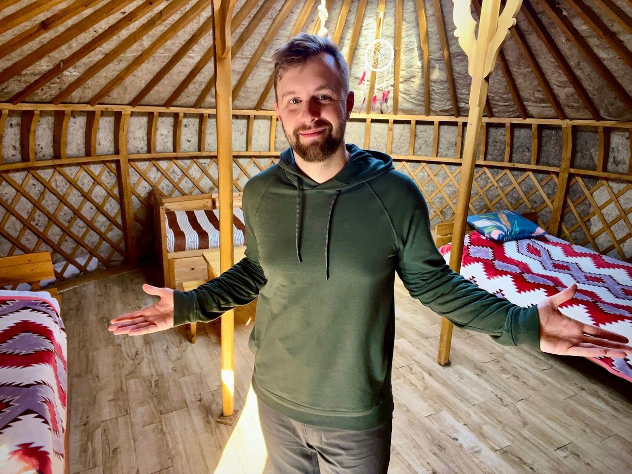A photo of Mike inside his yurt in rural Mongolia (booke with points)