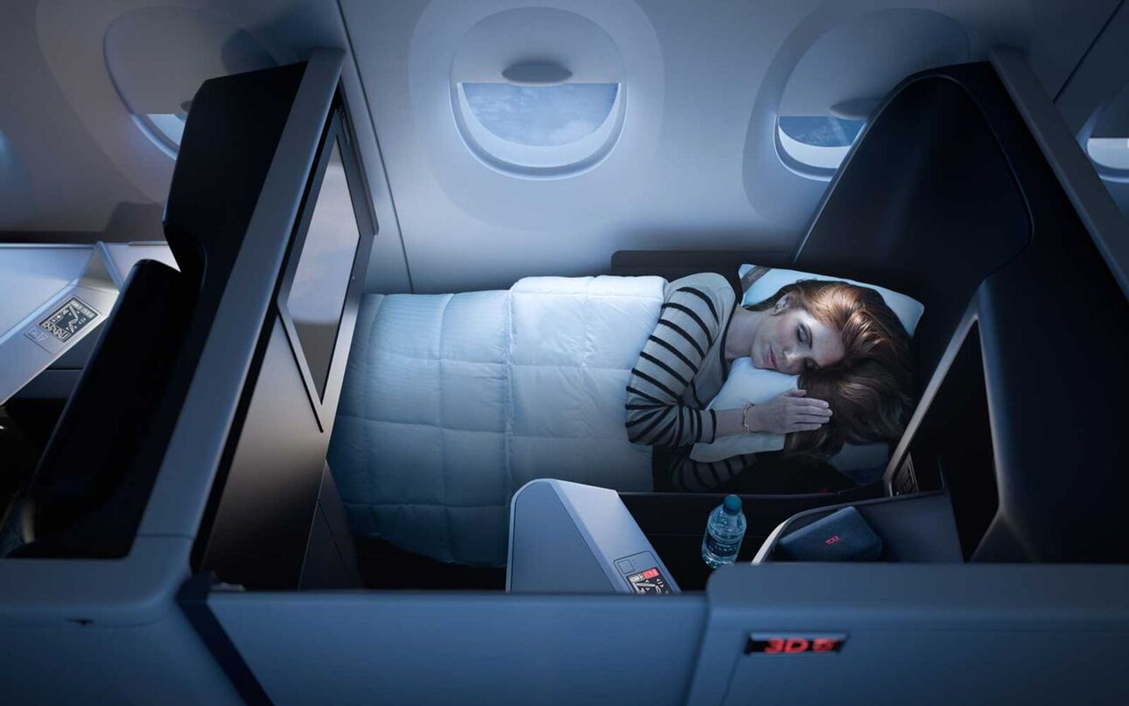 Photo of someone sleeping in a Delta One suite