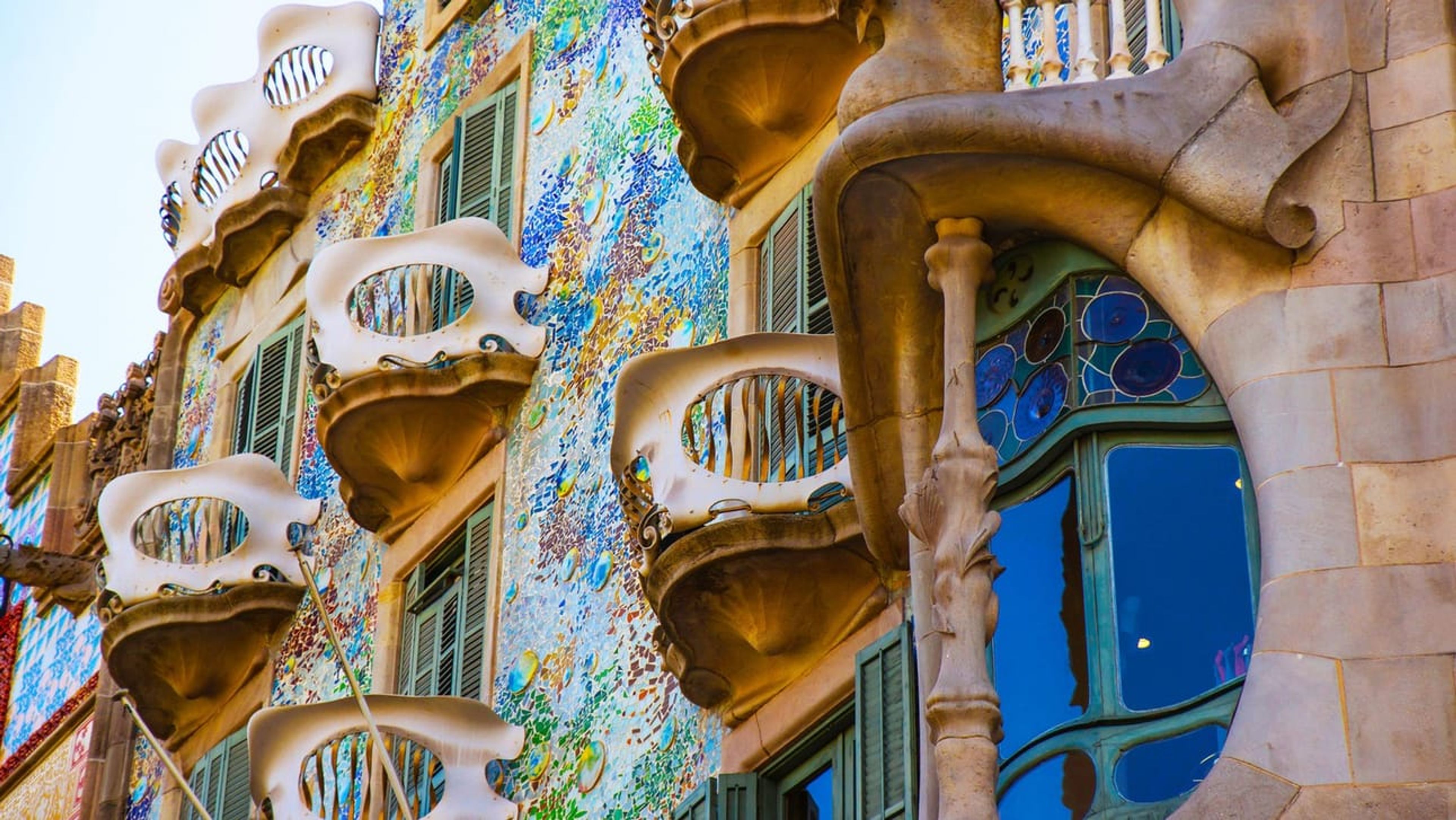 A side of a buldingwith unique architecture and murals from Gaudi