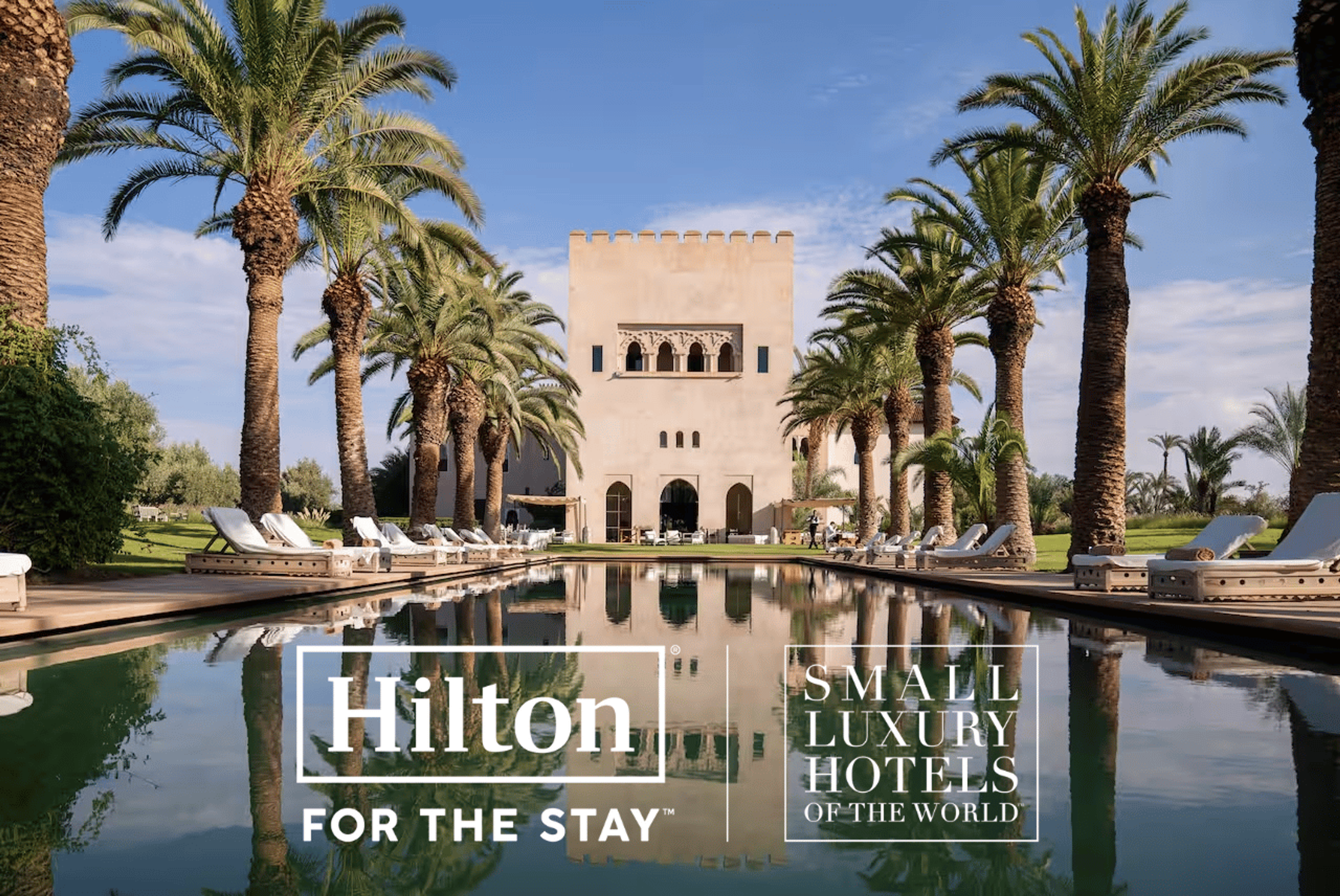 A photo of a hotel with the logos of Hilton and SLH