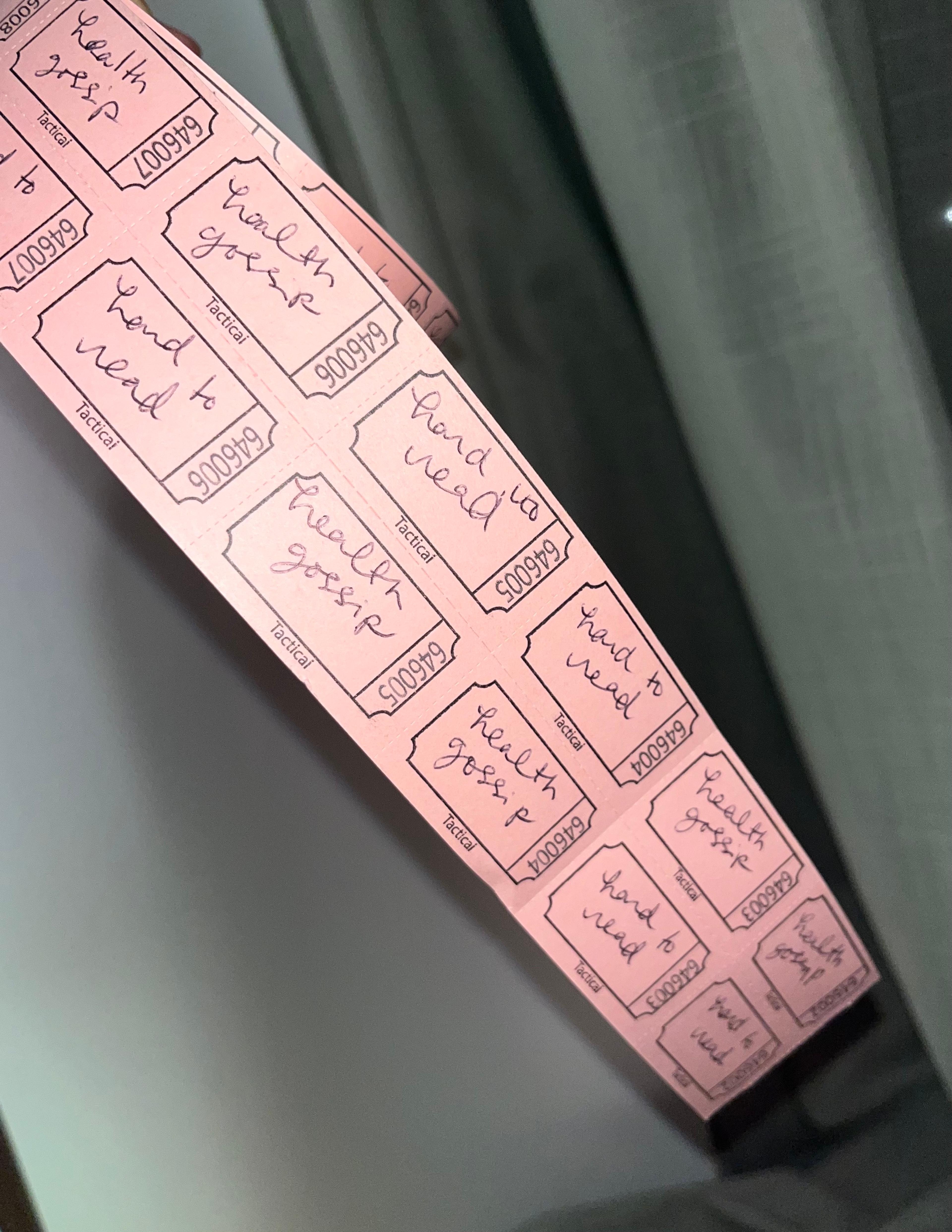 Picture of raffle tickets marked Health Gossip and Hard to Read