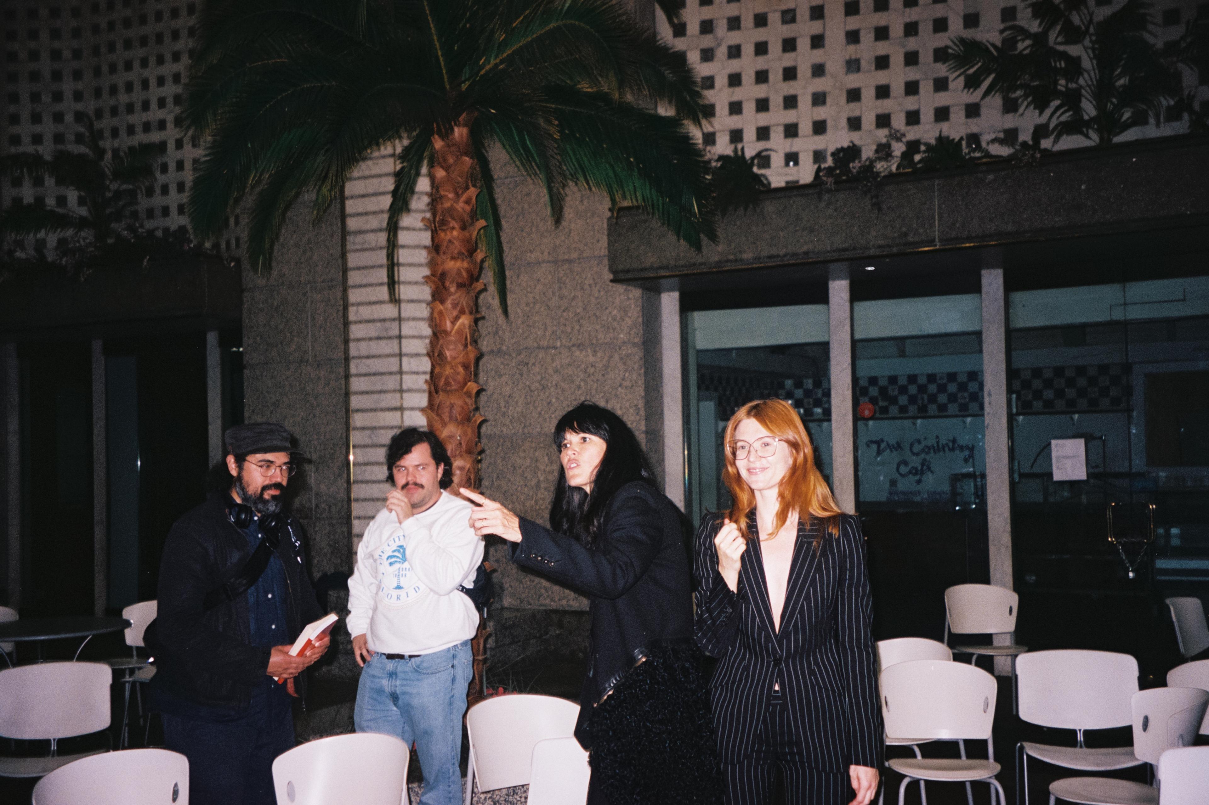 Jamieson Webster, Fiona Alison Duncan, Moises, and unknown in 60 Wall Street atrium